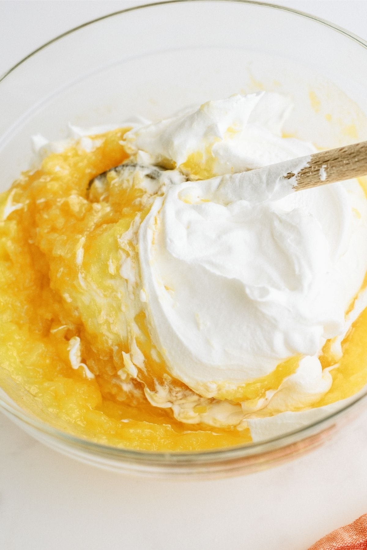 Mixing topping ingredients together in a glass bowl