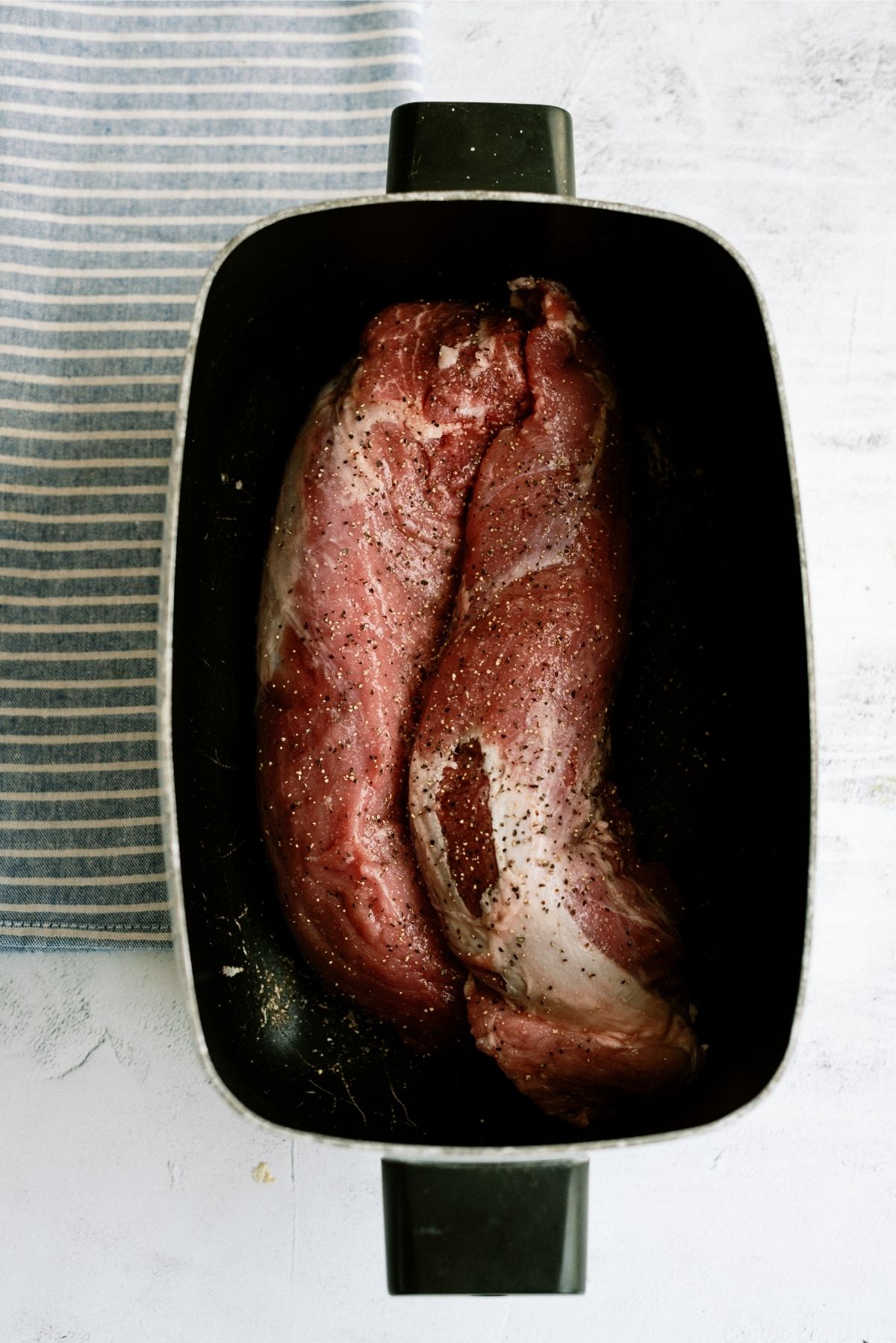 Uncooked pork tenderloin in slow cooker