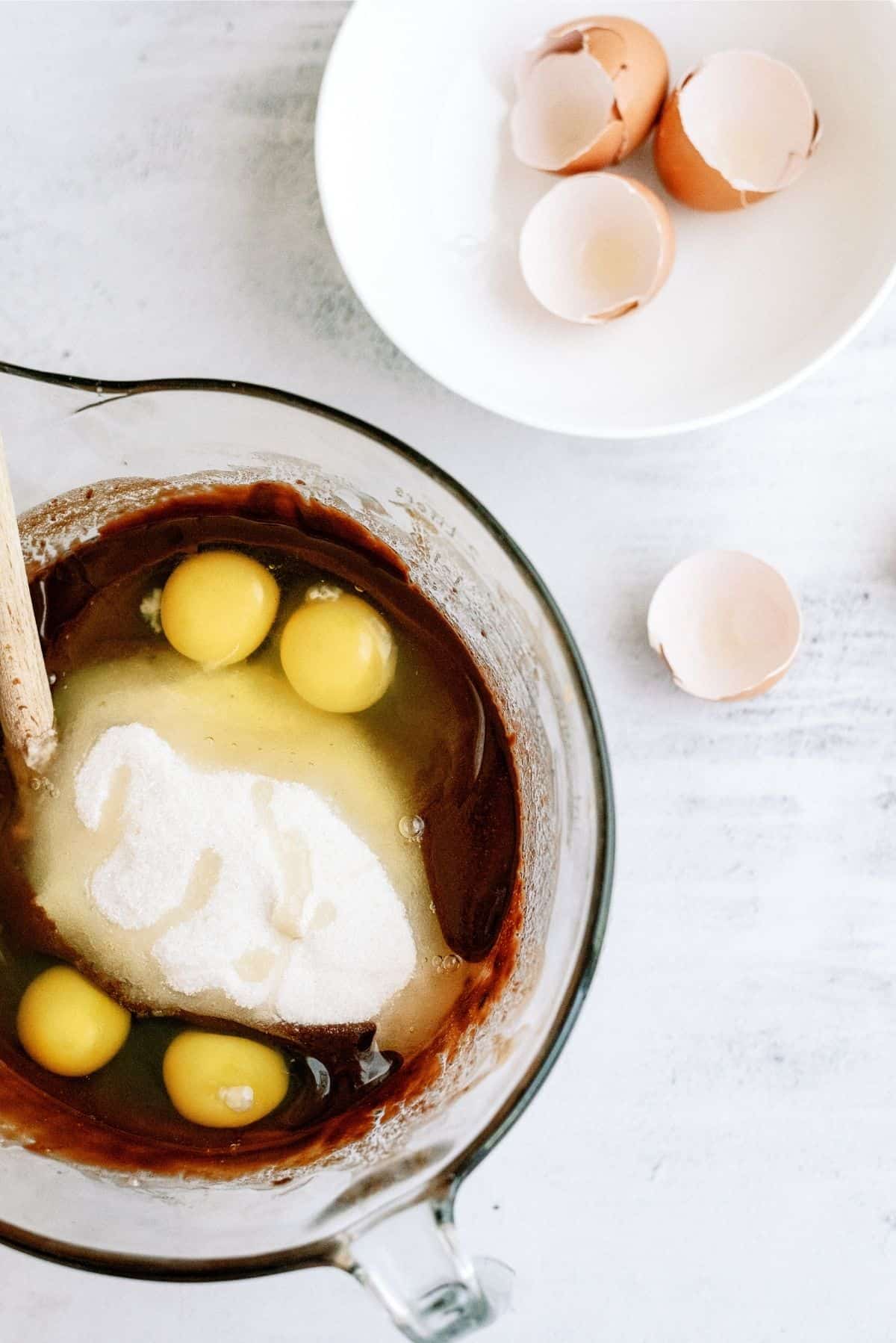 sugar, eggs and vanilla extract mixed in with chocolate mixture