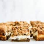 Chocolate Chip Cheesecake Blondies sliced into squares to show the inside.