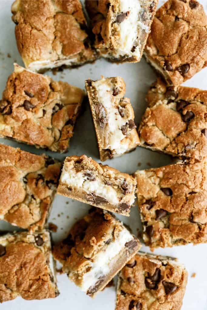Chocolate Chip Cheesecake Blondies cut into squares with the inside showing.