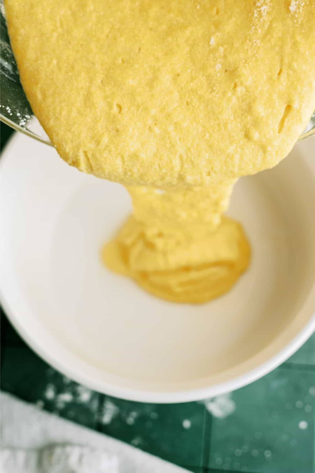 Pouring Cornbread Batter into  round cake pan