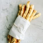 Homemade Pizza Factory Breadsticks bundled with paper and string.