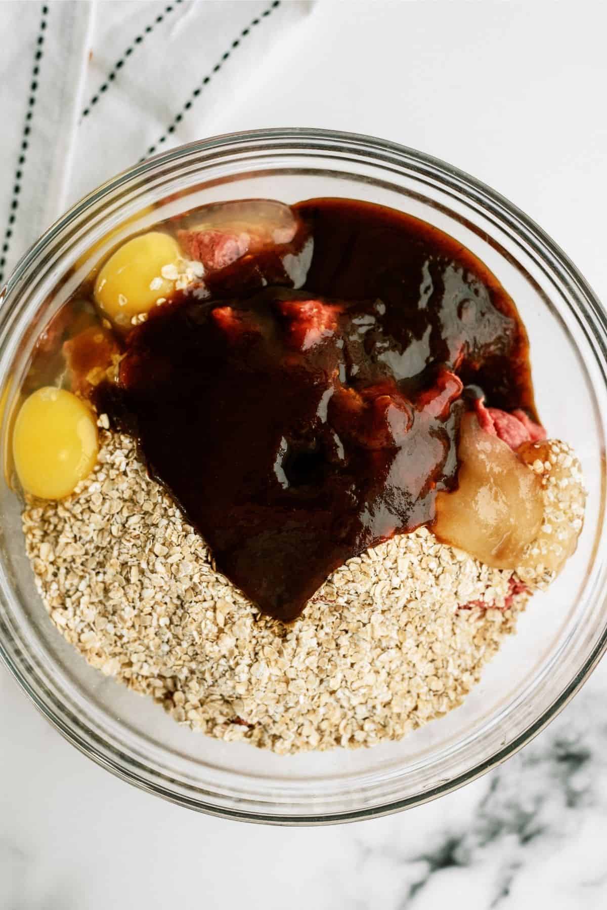 Meatloaf ingredients together in glass bowl