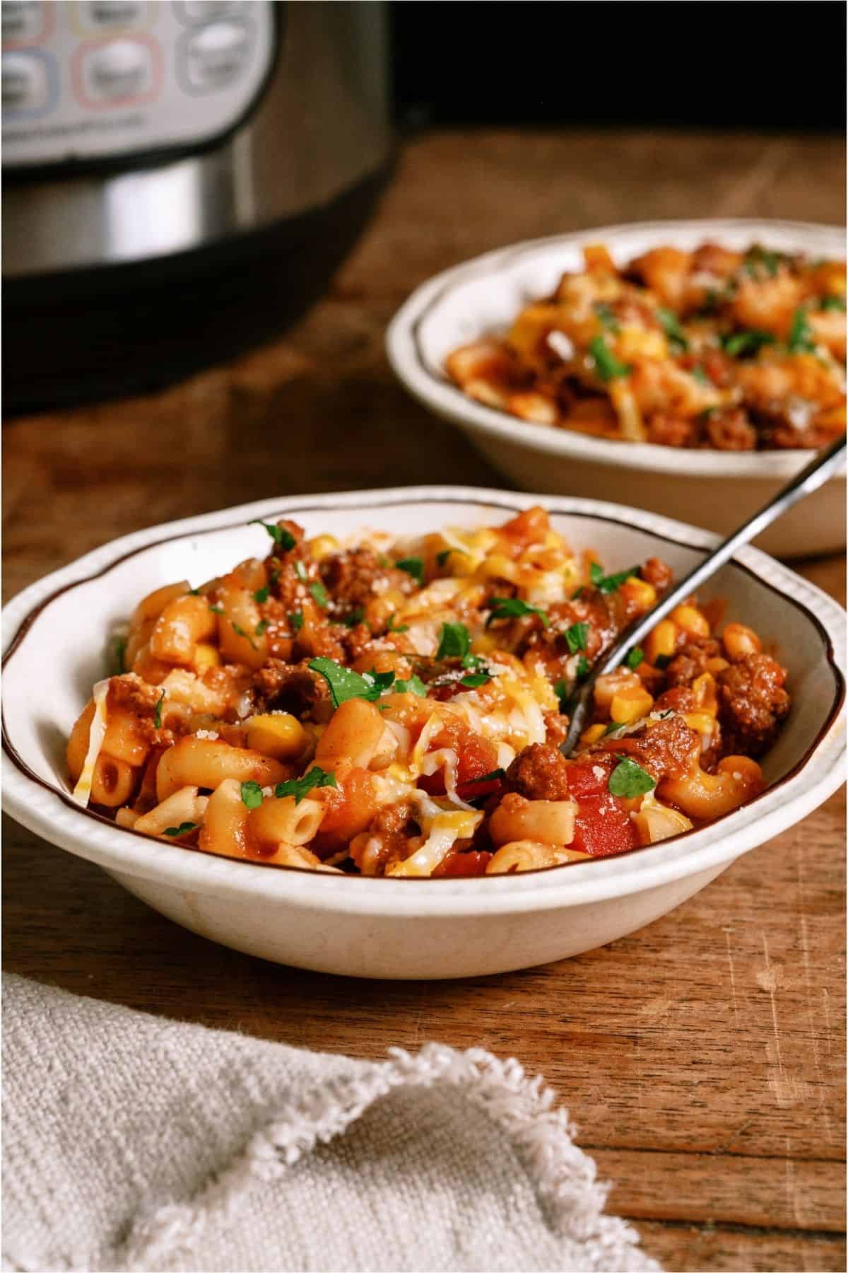 Two bowls with servings of Instant Pot Ground Beef Goulash.