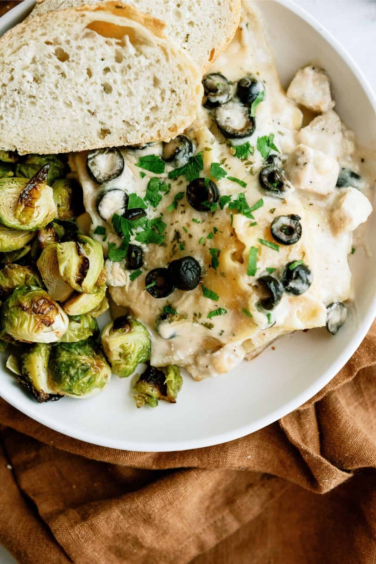 Slow Cooker Chicken Alfredo Lasagna on white plate