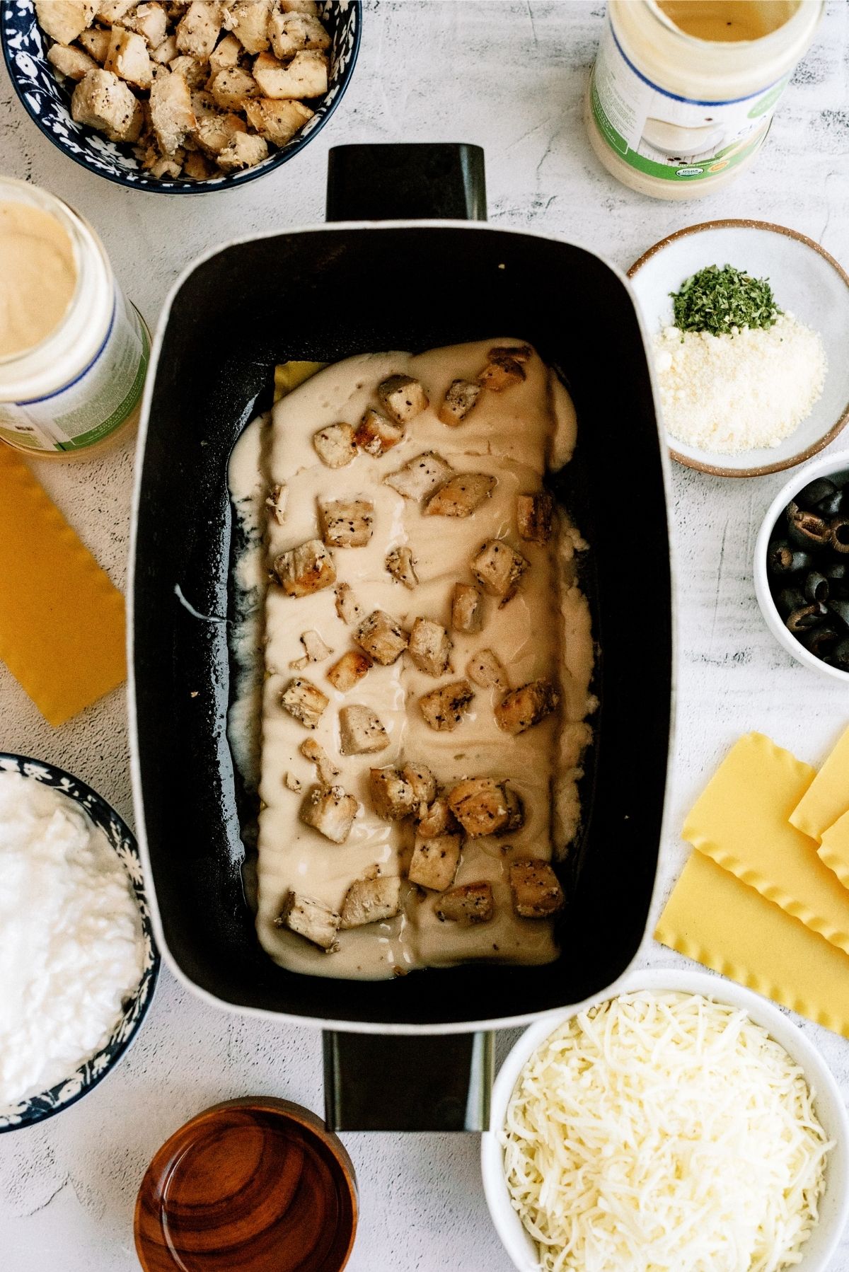 Chicken and alfredo sauce layered in crock pot