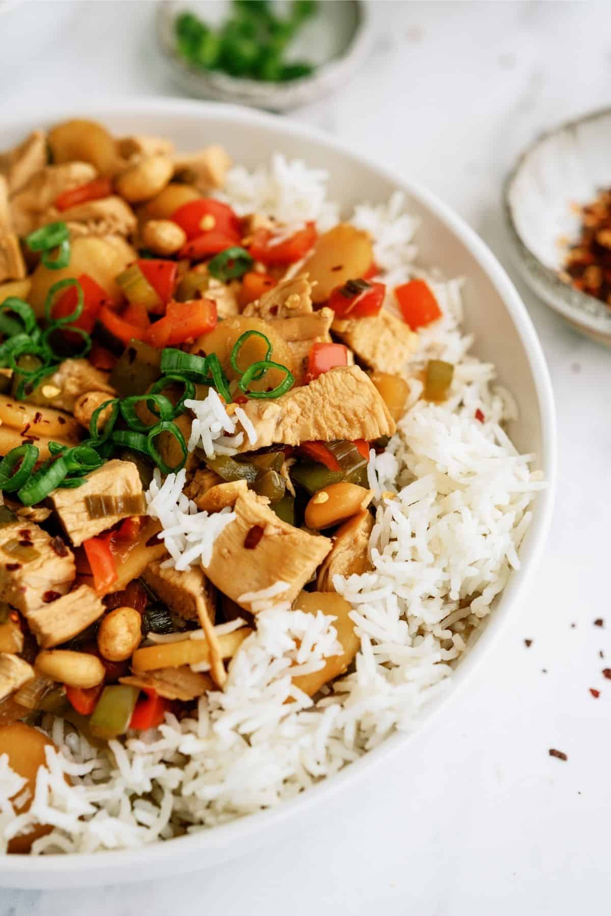 Slow Cooker Kung Pao Chicken Recipe in a bowl served over rice