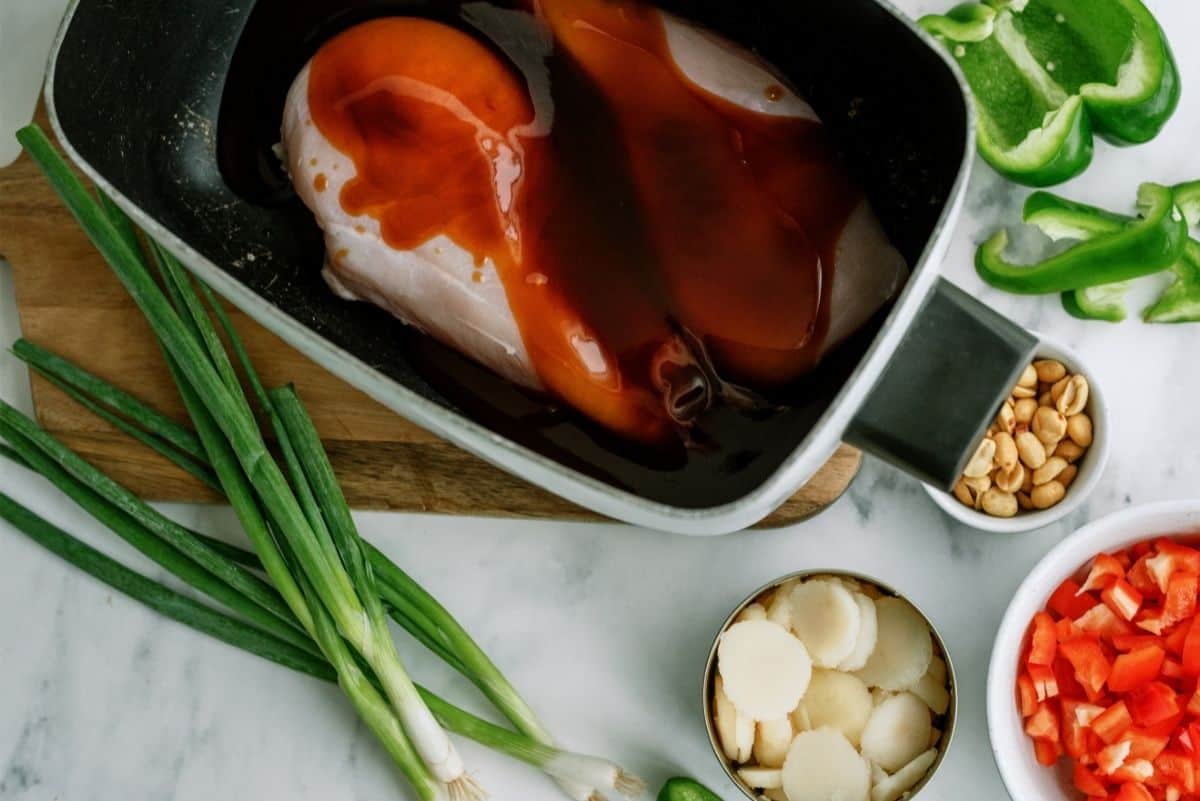 Chicken breast in slow cooker with Kung Pao Sauce on top