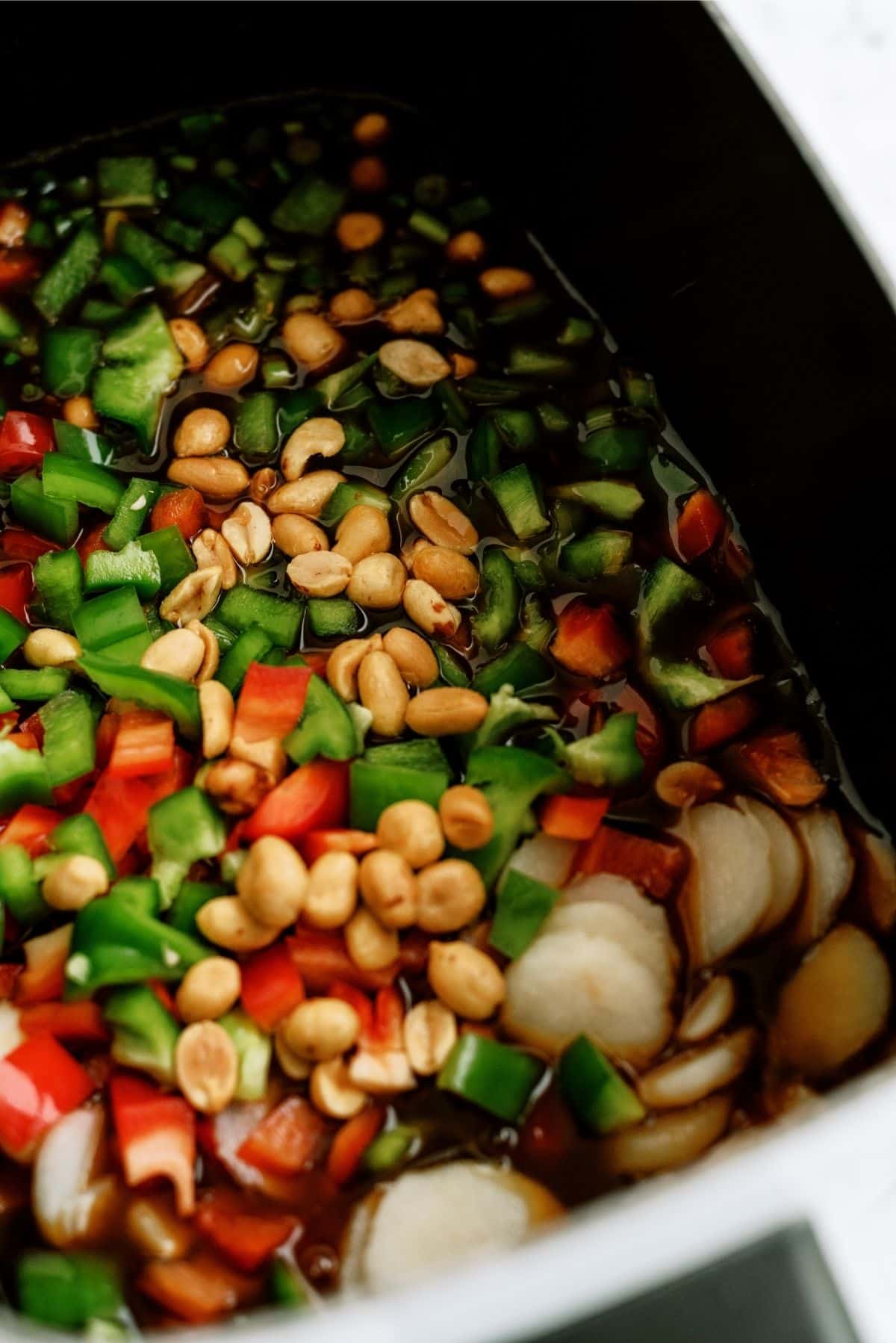 All ingredients for Slow Cooker Kung Pao Chicken inside the Slow Cooker