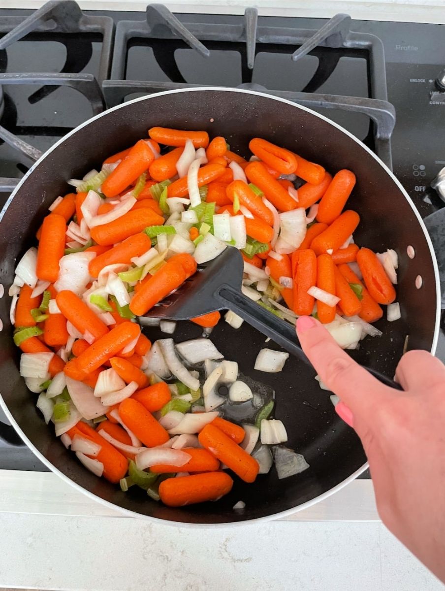 scraping the brown bits off the bottom of the pan while the vegetables cook