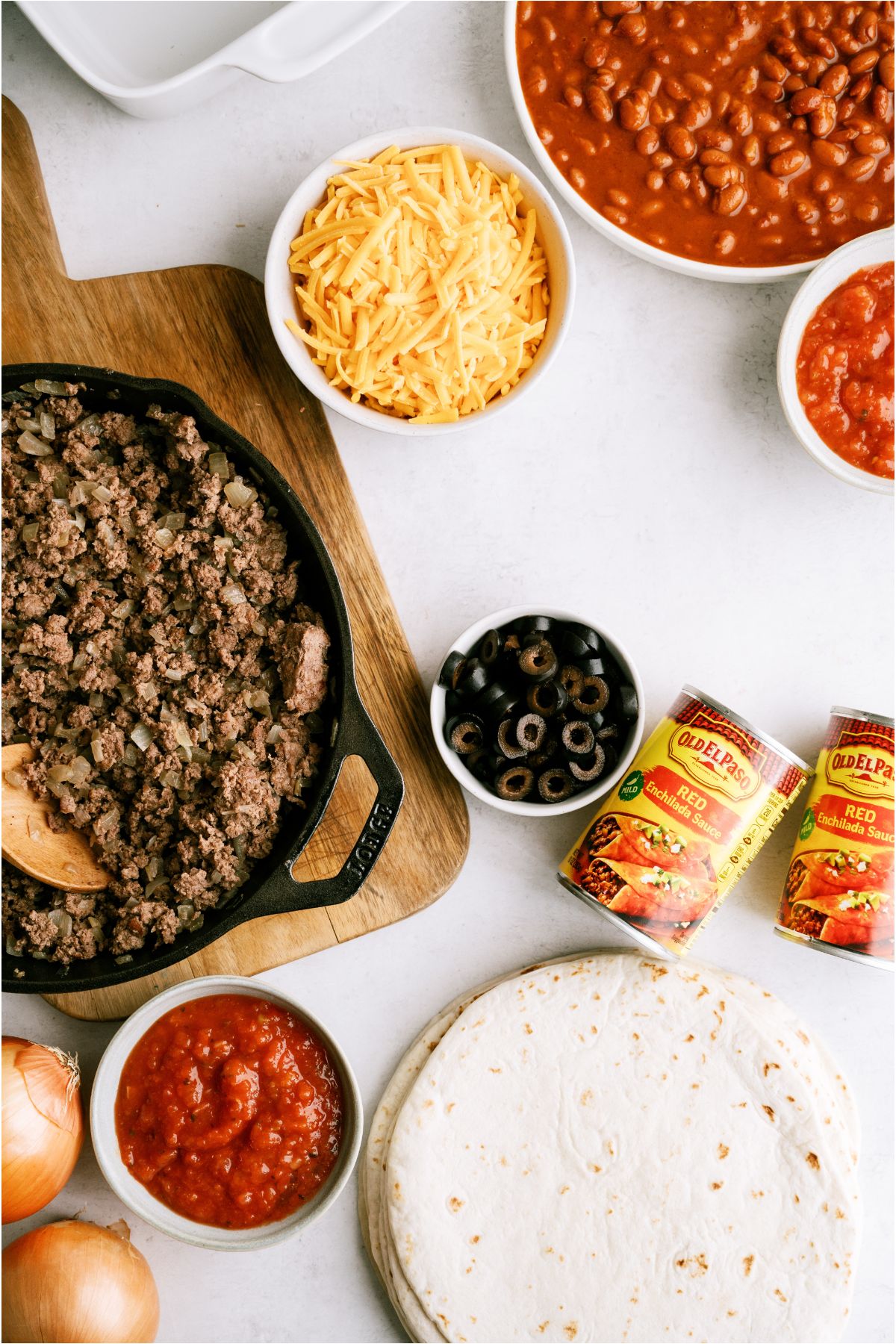 Ingredients needed to make Hearty Ground Beef Enchiladas.