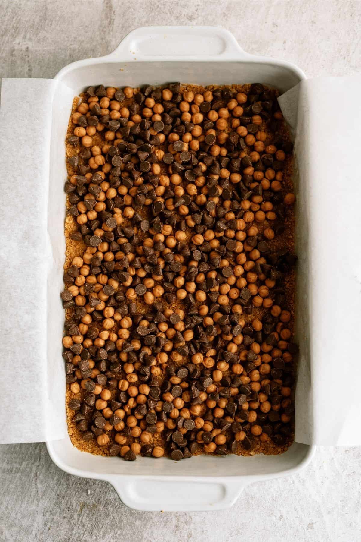 Chocolate chips sprinkled over crust and caramel bits