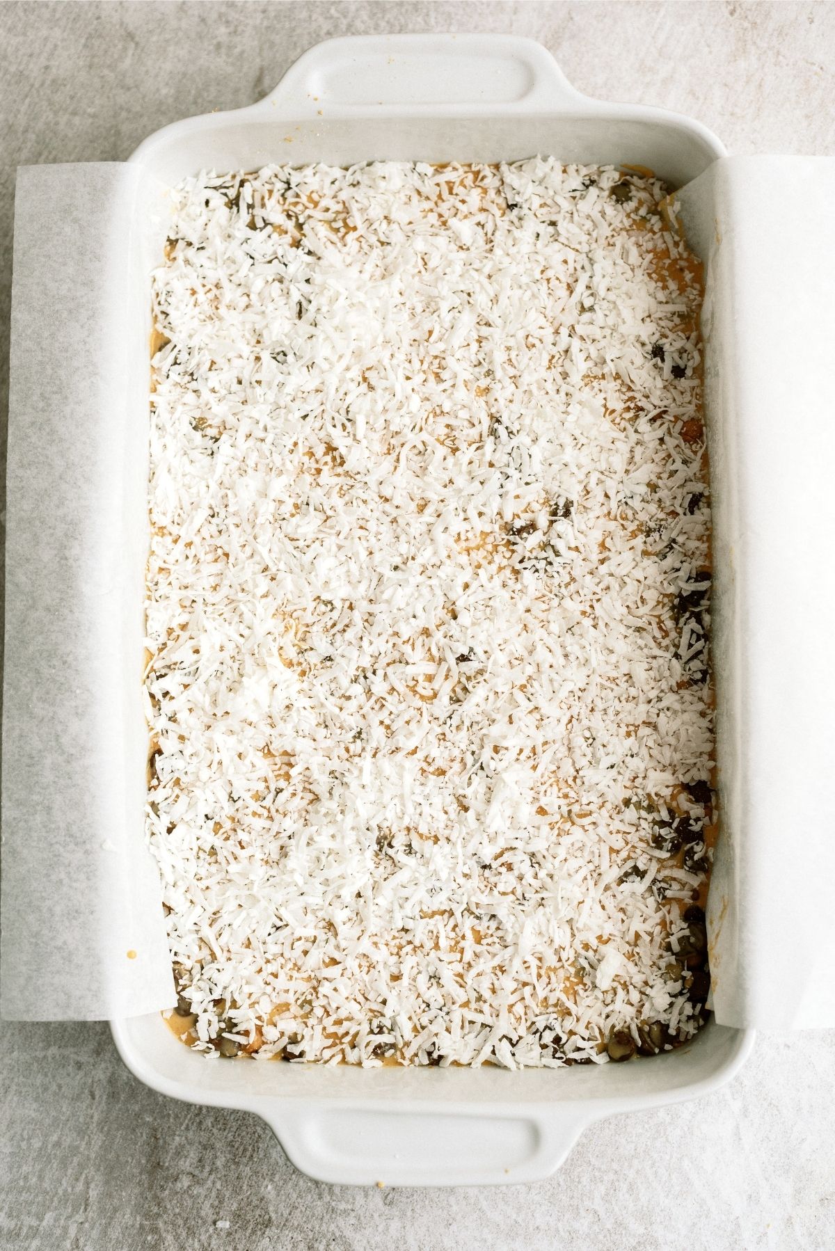 Sprinkled sweetened coconut flakes over pumpkin layer