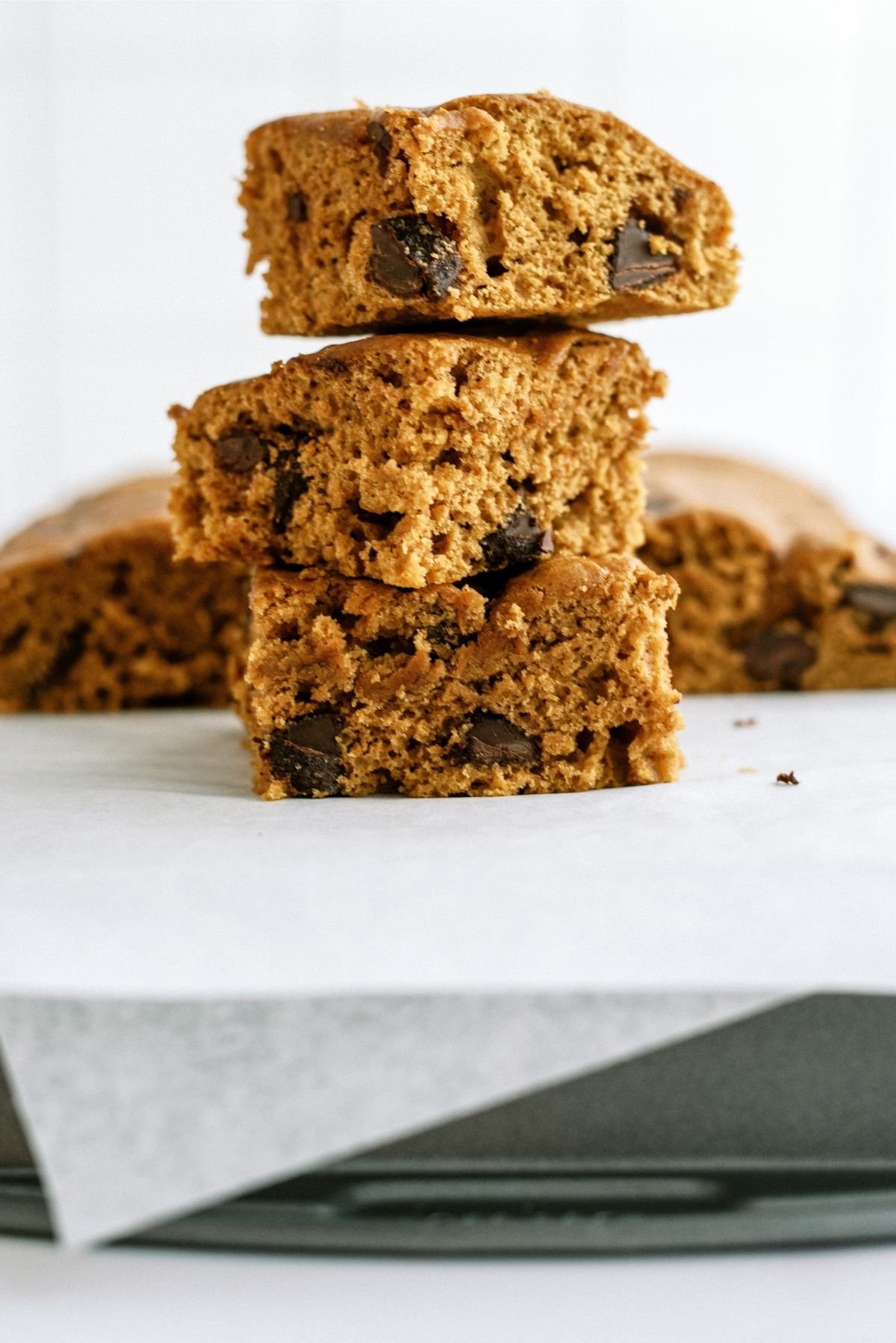 Pumpkin Chocolate Chip Brownies cut into squares and stacked