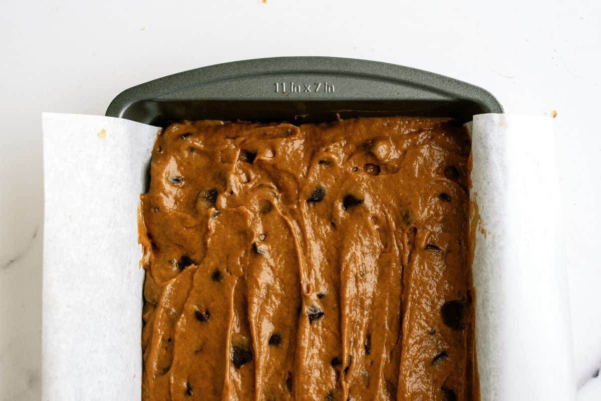 Unbaked Pumpkin Chocolate Chip Brownie batter in baking pan