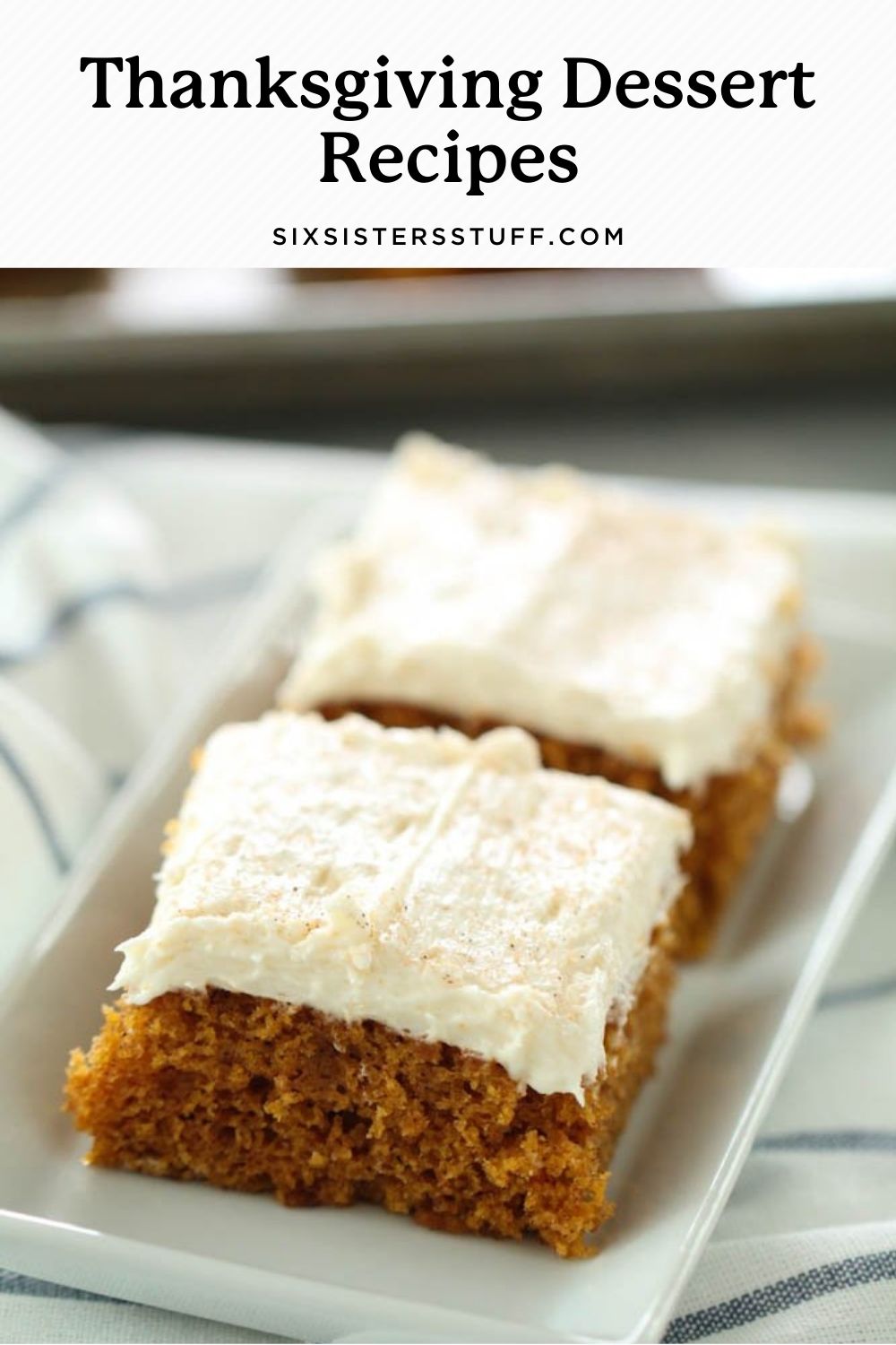 pumpkin sheet cake with thick white frosting on top