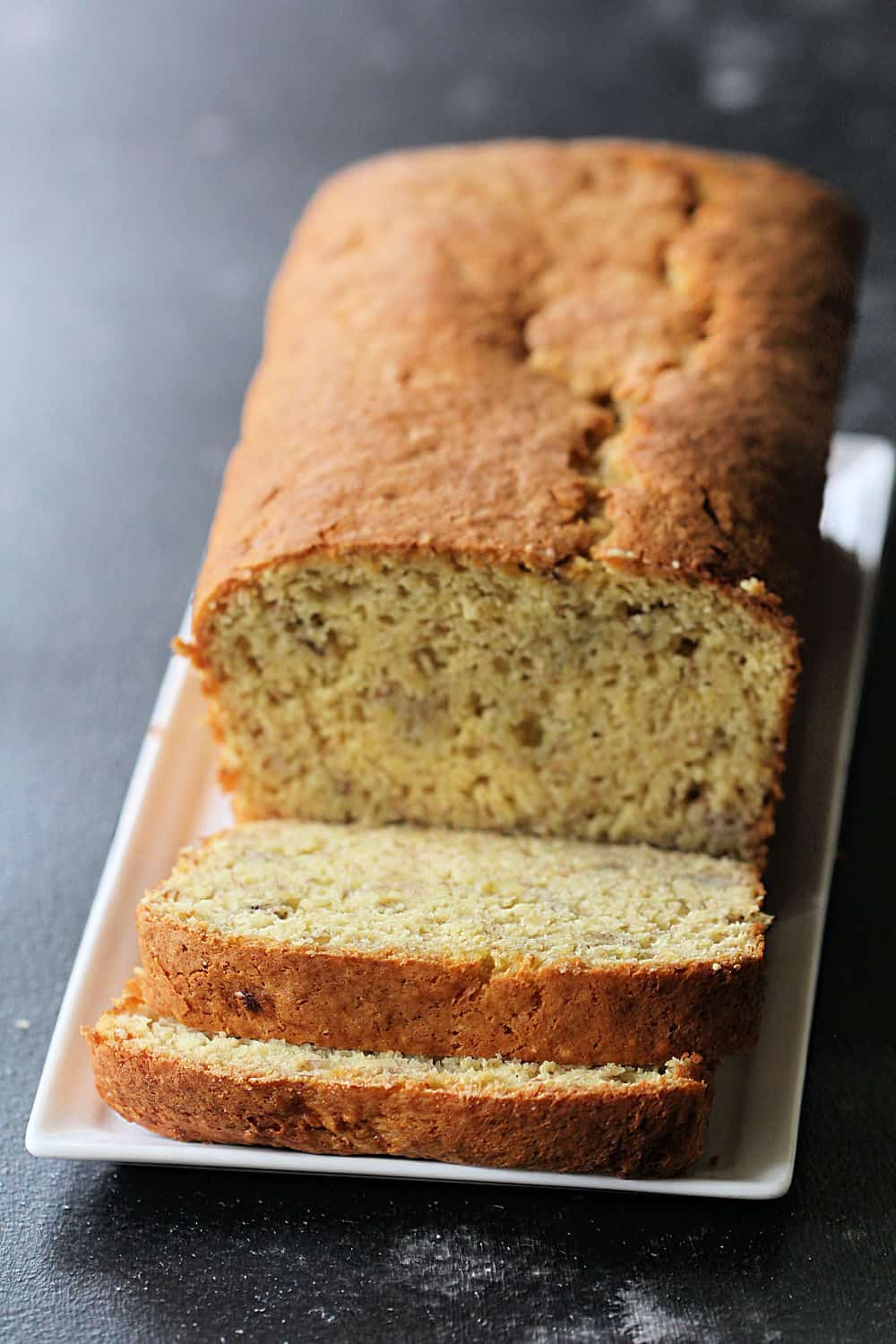 3 Ingredient Banana Bread sliced on a serving plate