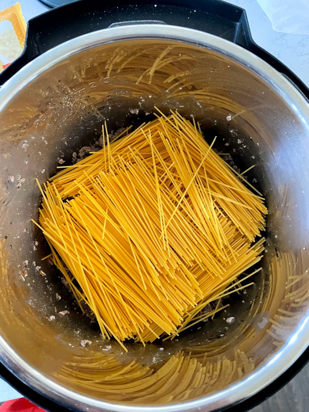 Spaghetti Noodles broken in half and placed in criss cross pattern in bottom of the Instant Pot