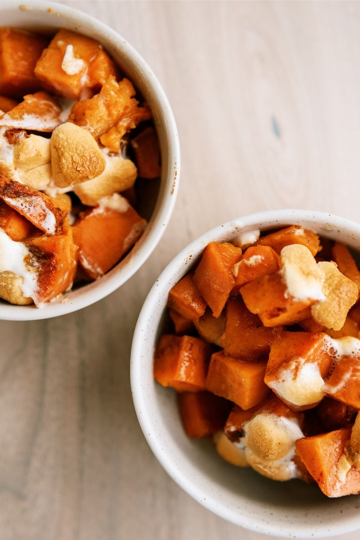 Candied Yams without Corn Syrup dished into 2 white bowls