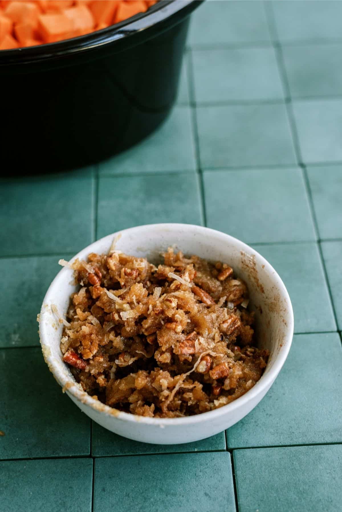 Coconut Pecan mixture mixed together in white bowl