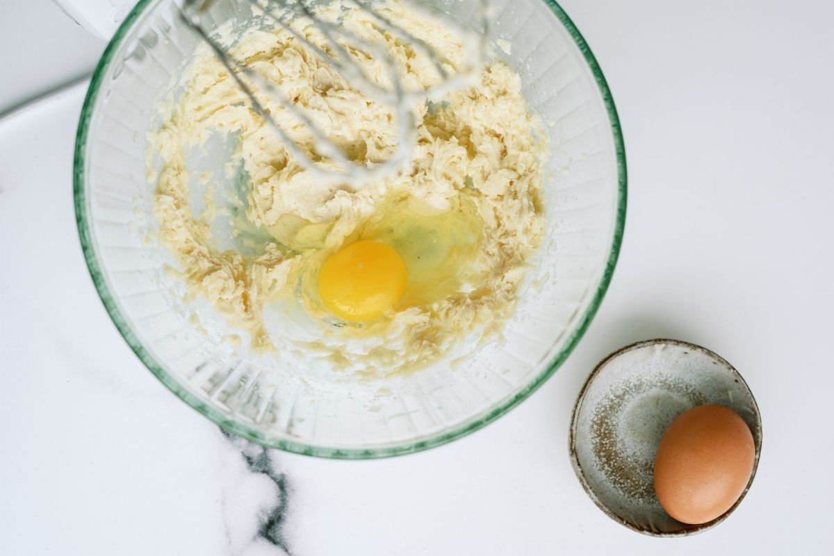 Sugar, Butter and Eggs mixed in a large mixing bowl
