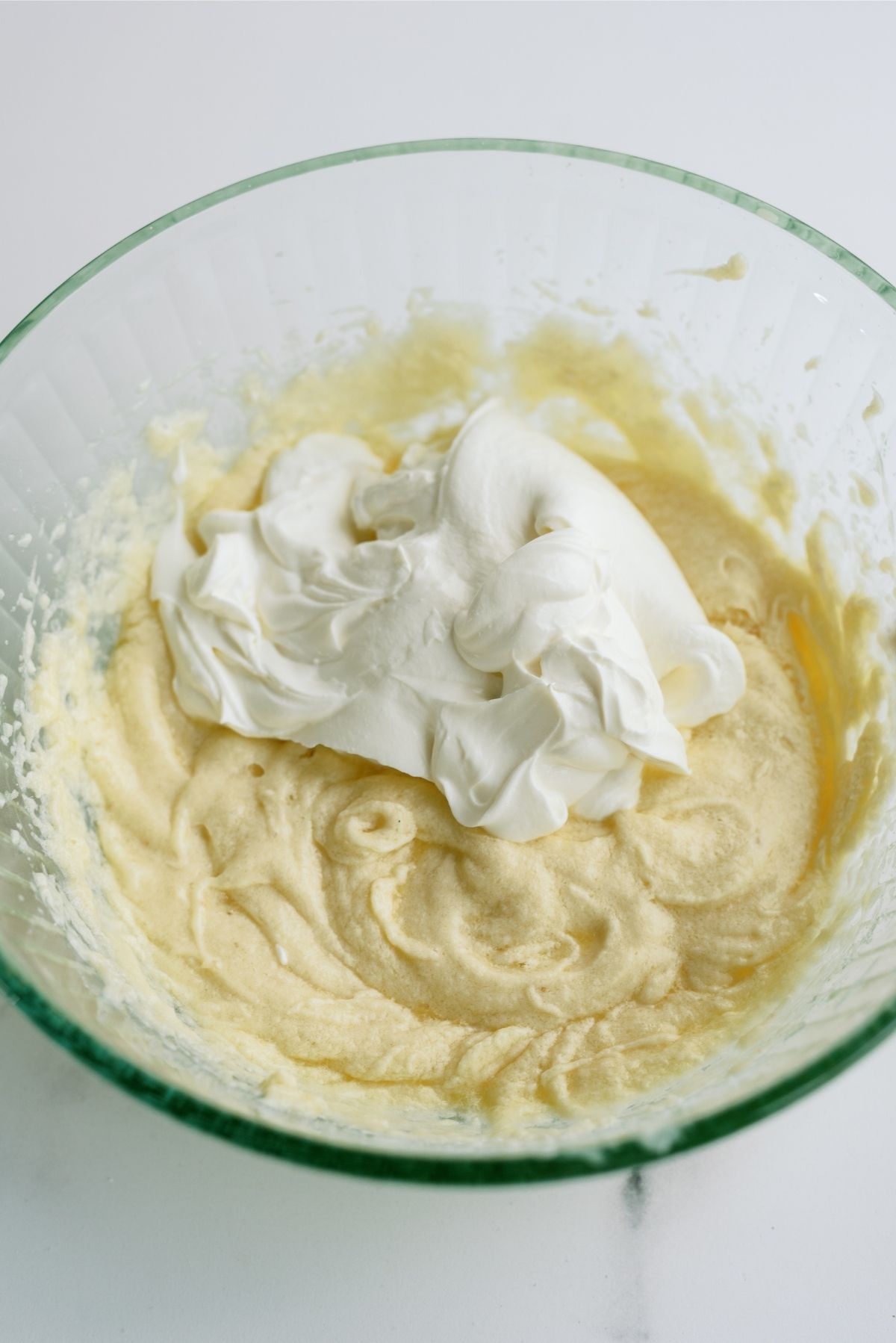 Adding sour cream to the mixture