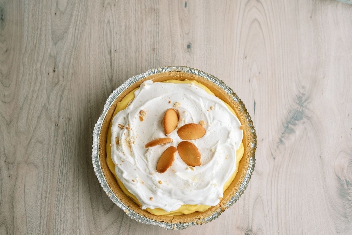 Easy Banana Cream Pie in pie tin on a counter top.