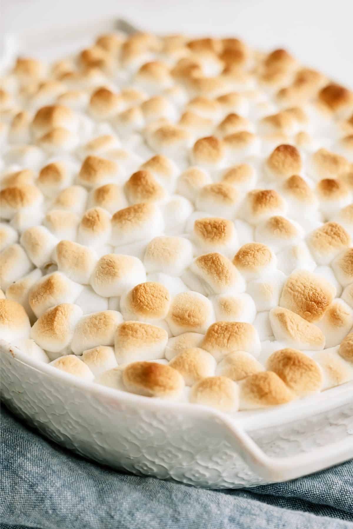 Mom's Sweet Potatoes in a casserole dish topped with toasted marshmallows