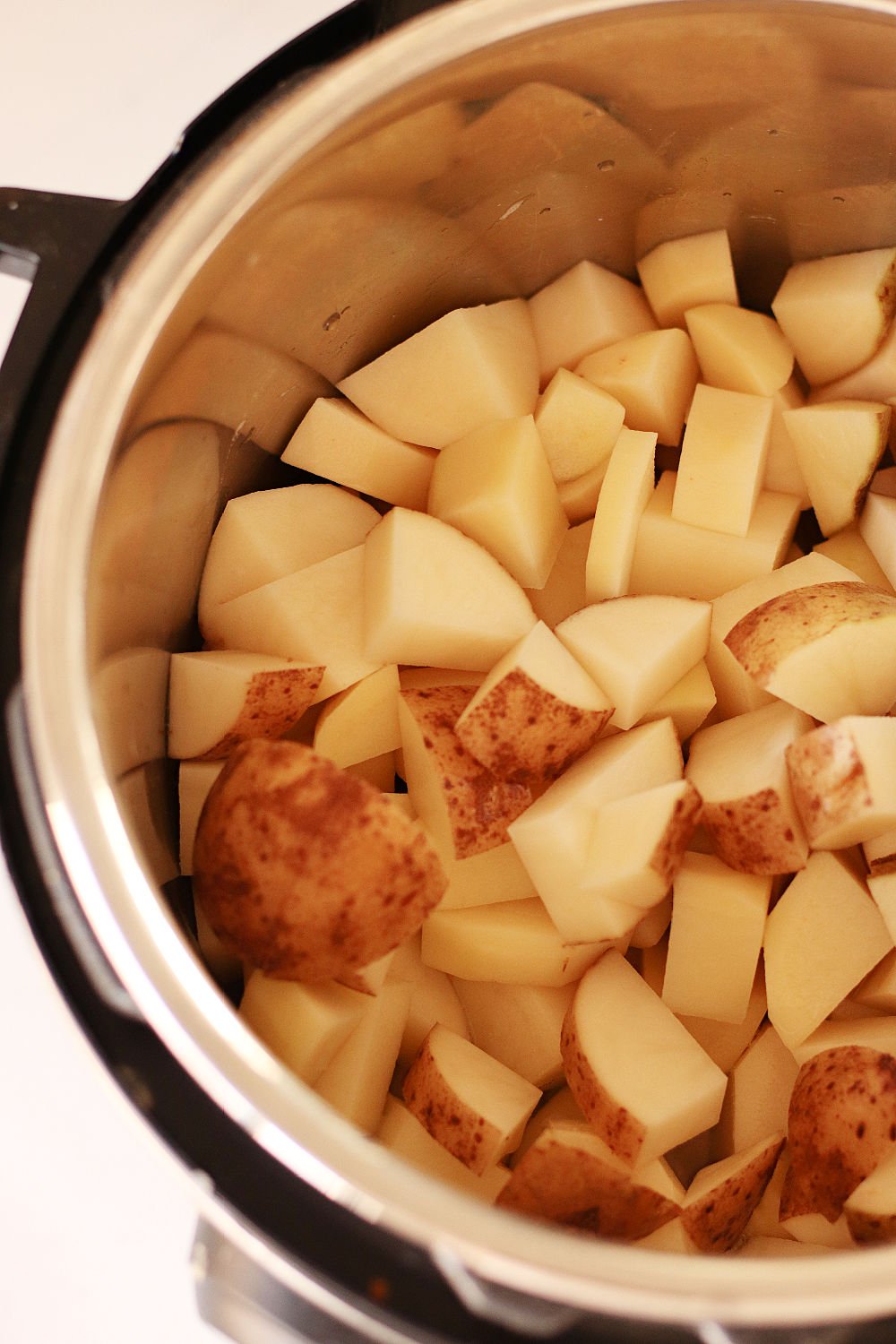 Cubed potatoes added to the instant pot