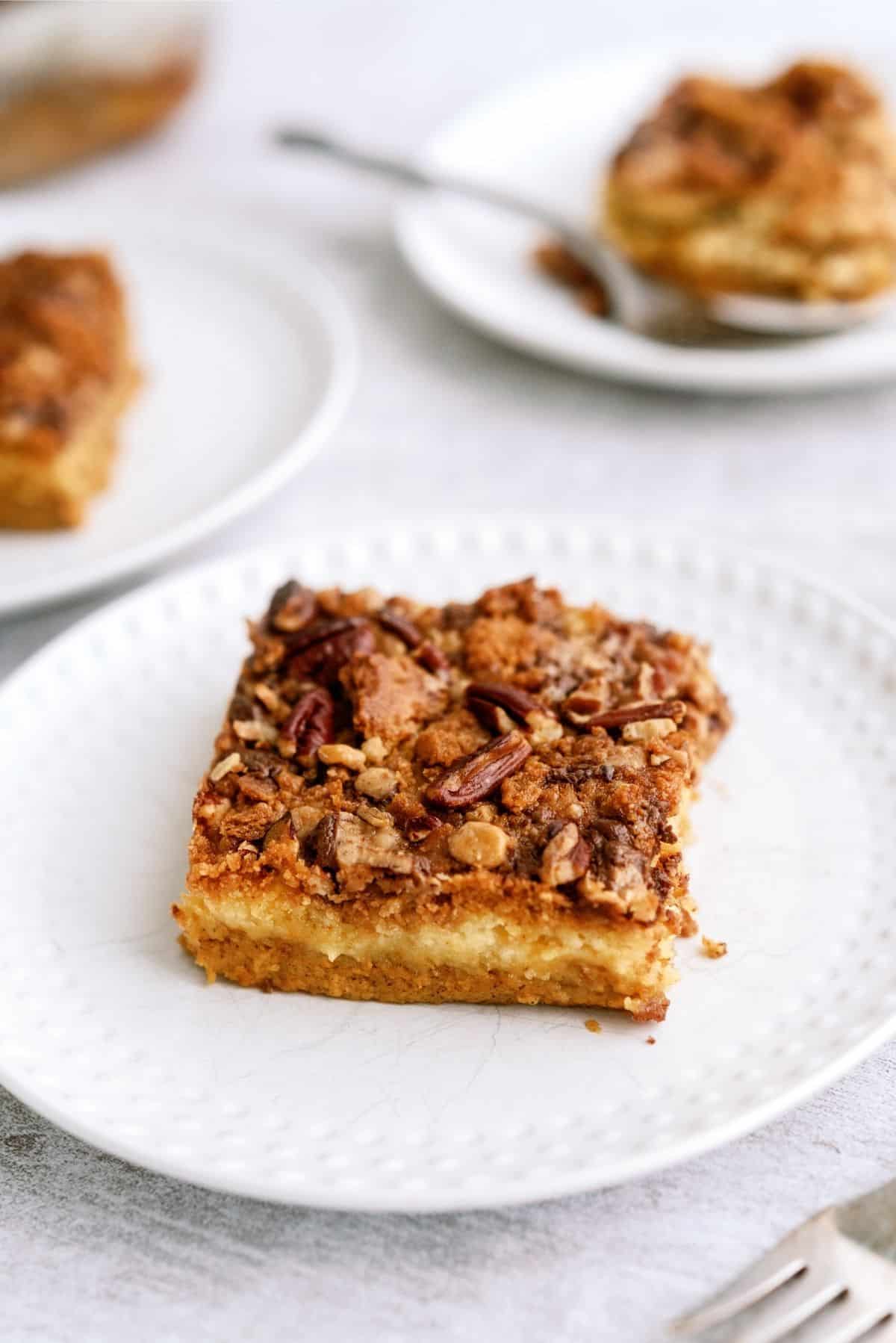 Slice of Pumpkin Dump Cake on a white plate