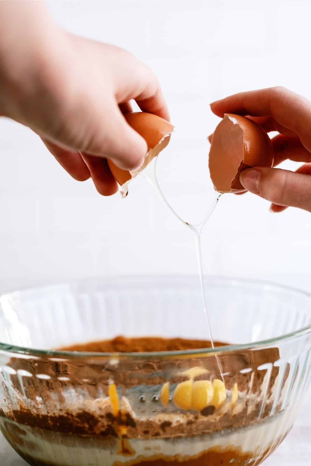 Adding eggs to the pumpkin sugar mixture