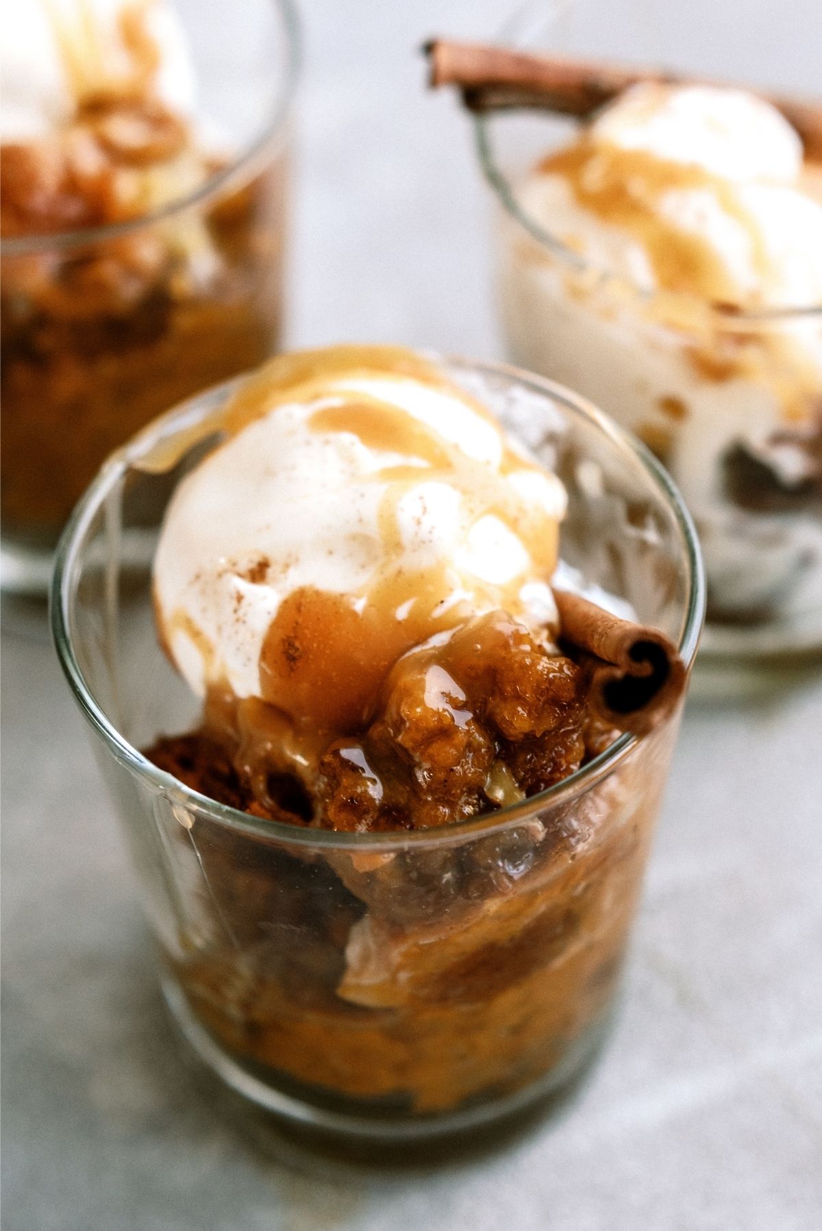 Pumpkin Pecan Cobbler in single serving cups topped with ice cram