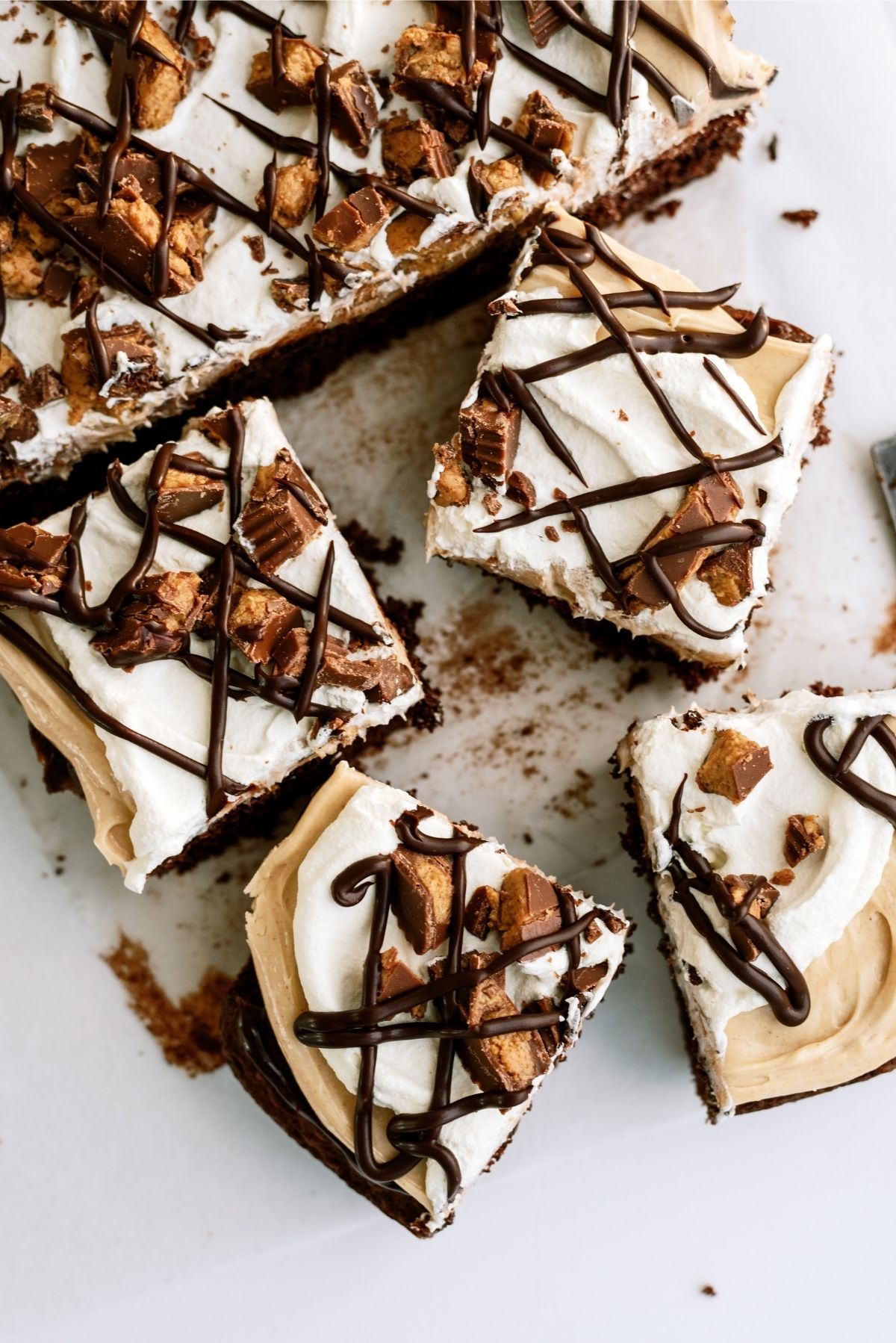 Reese’s Peanut Butter Poke Cake cut into squares