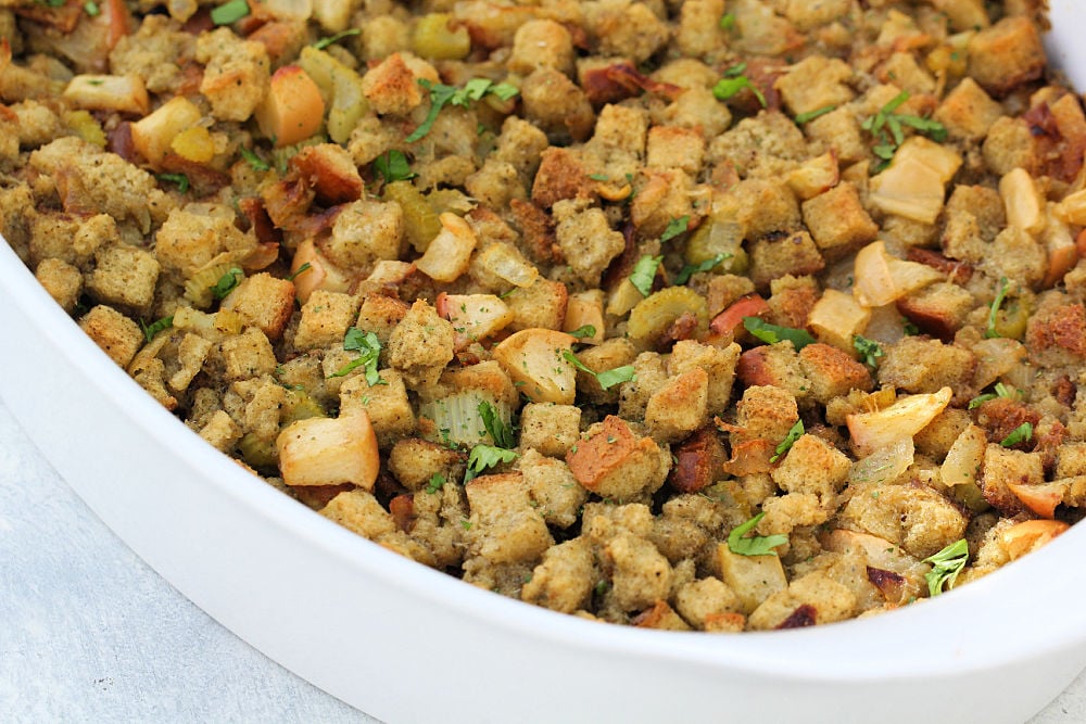 Apple, Onion and Celery stuffing in a white casserole dish