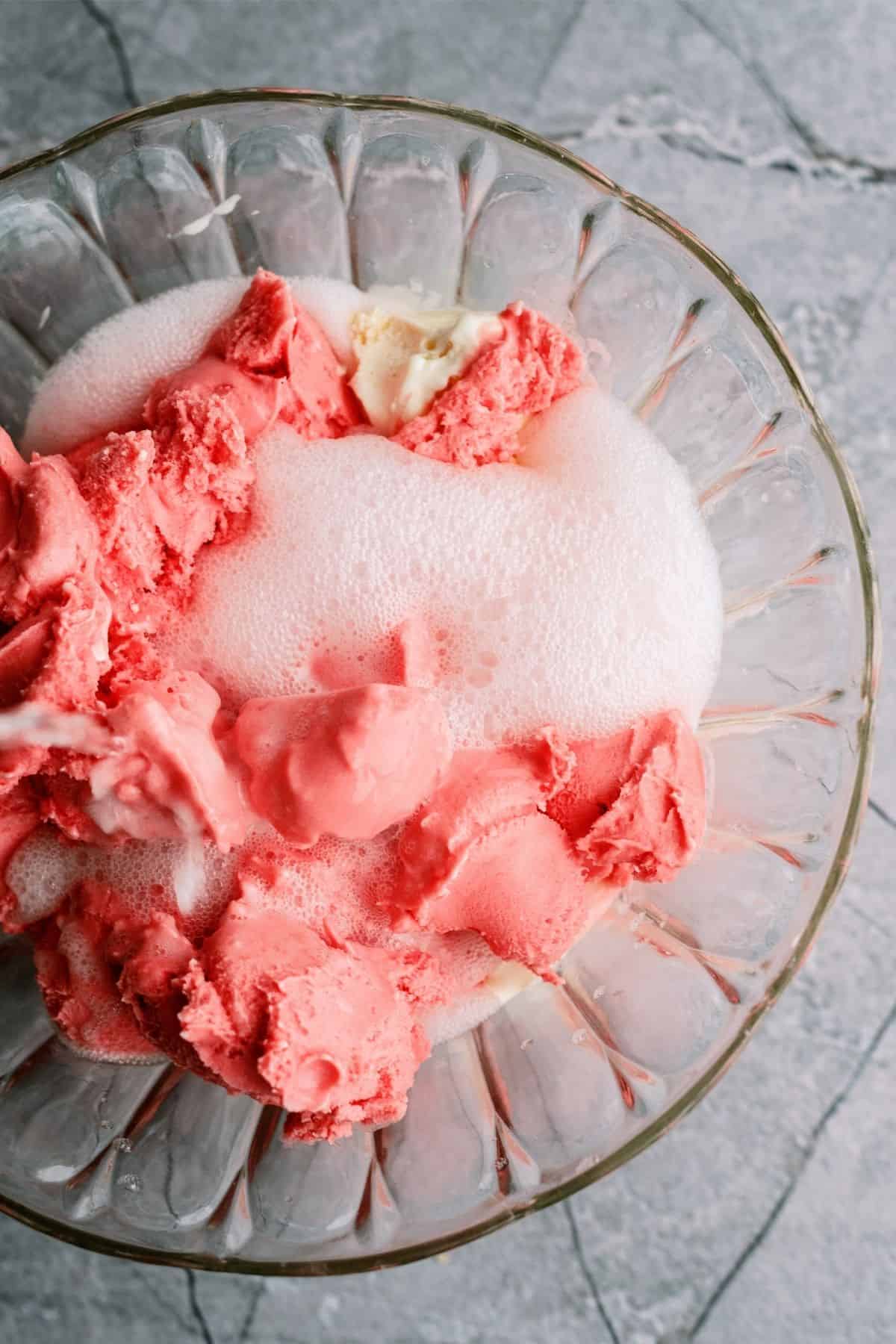 Mixture of lemon lime soda and ice cream in punch bowl