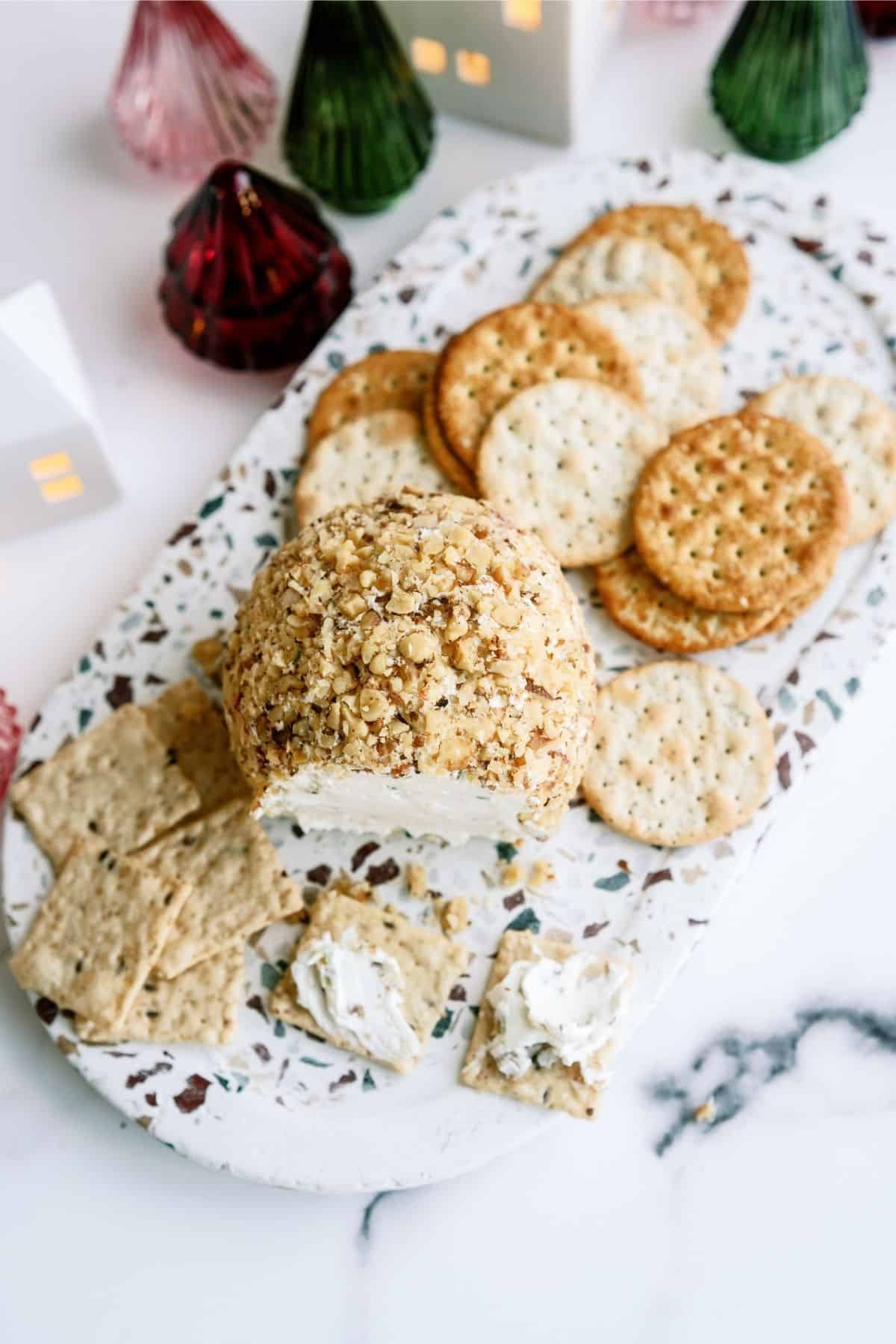 Grandma’s Holiday Cheese Ball on a serving platter with crackers