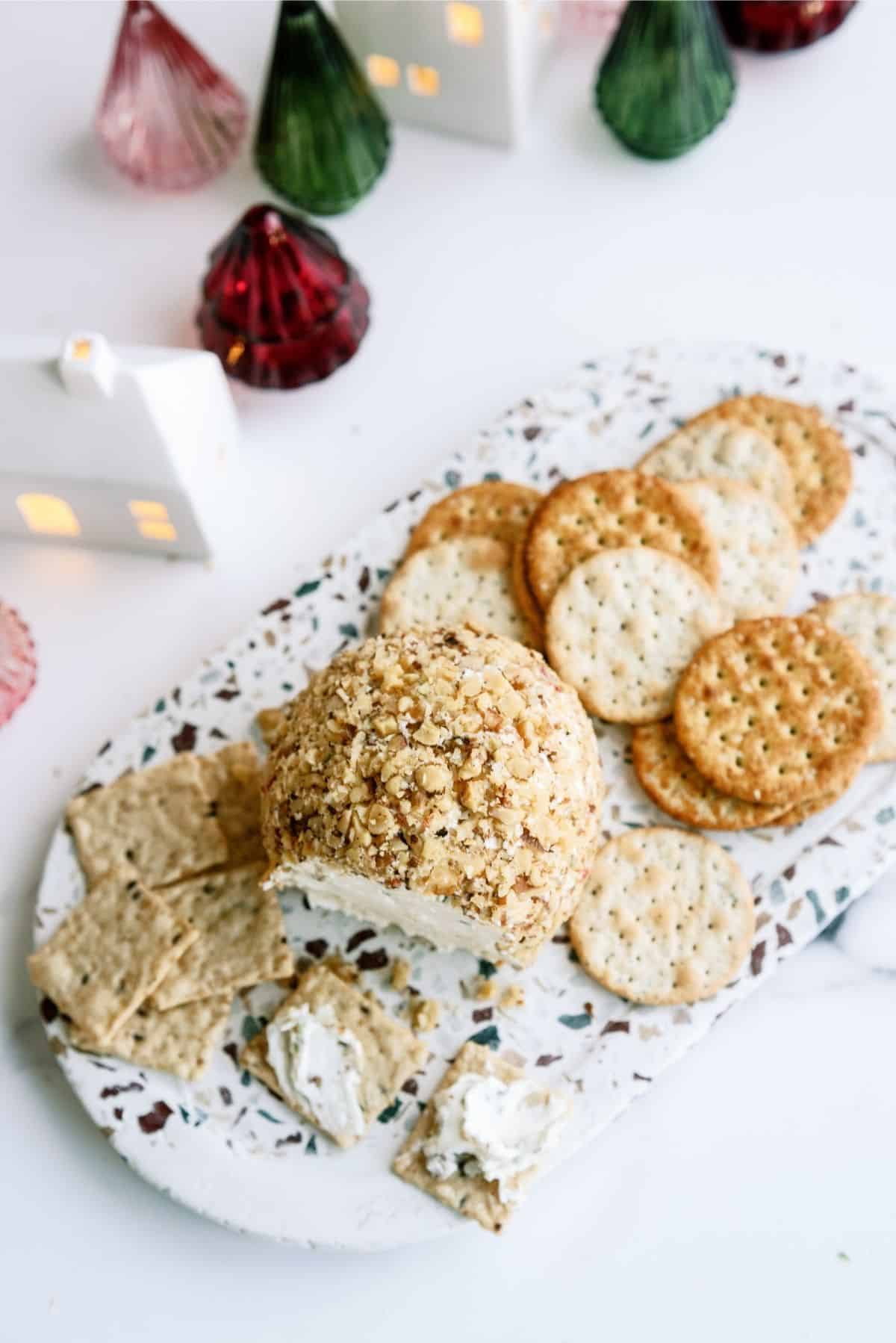 Grandma’s Holiday Cheese Ball on a platter with crackers