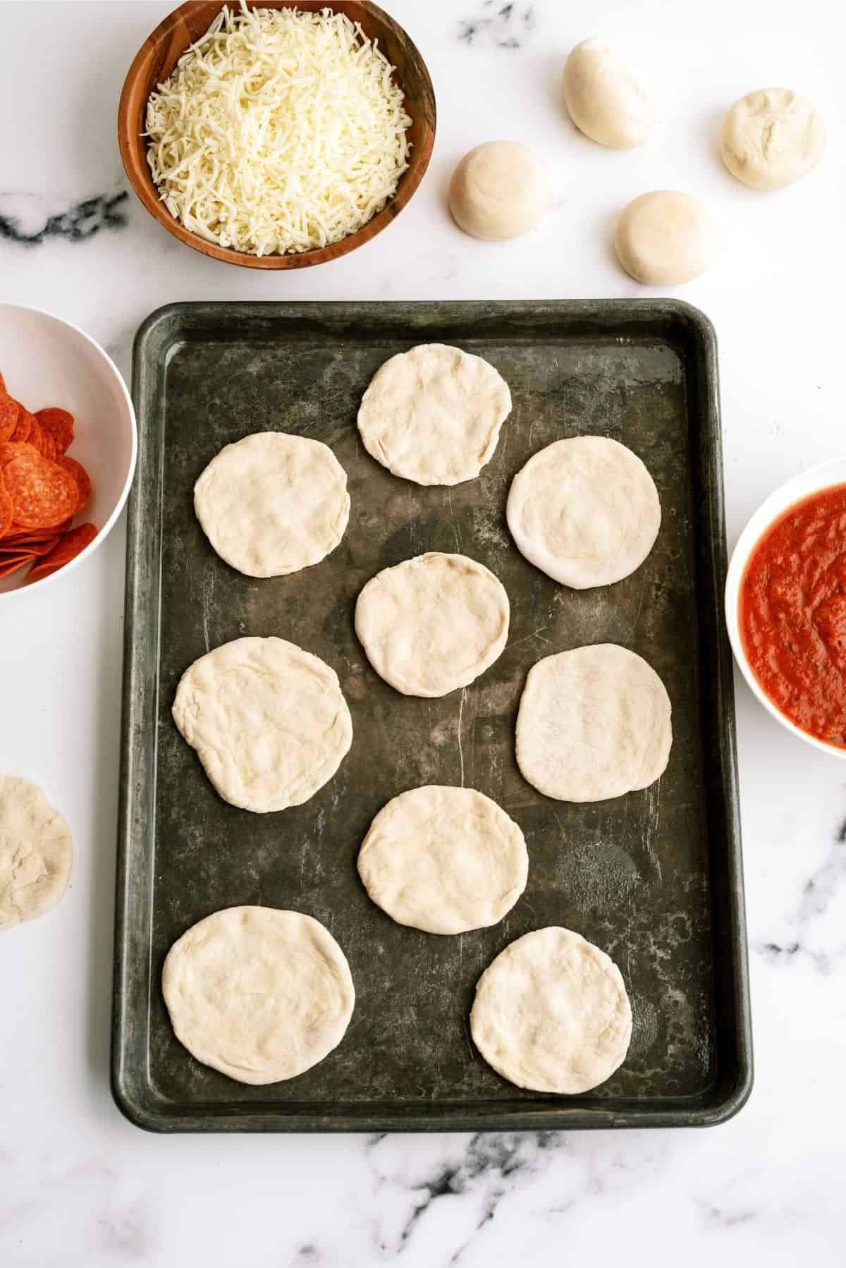 Flattened Roll Dough on a Sheet Pan