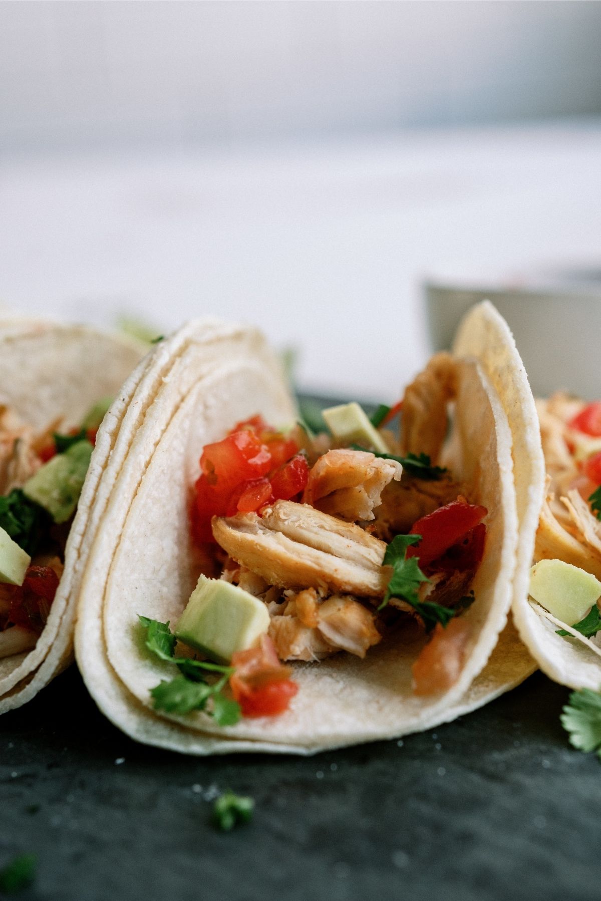 Instant Pot Chicken Carnitas in tortillas with toppings