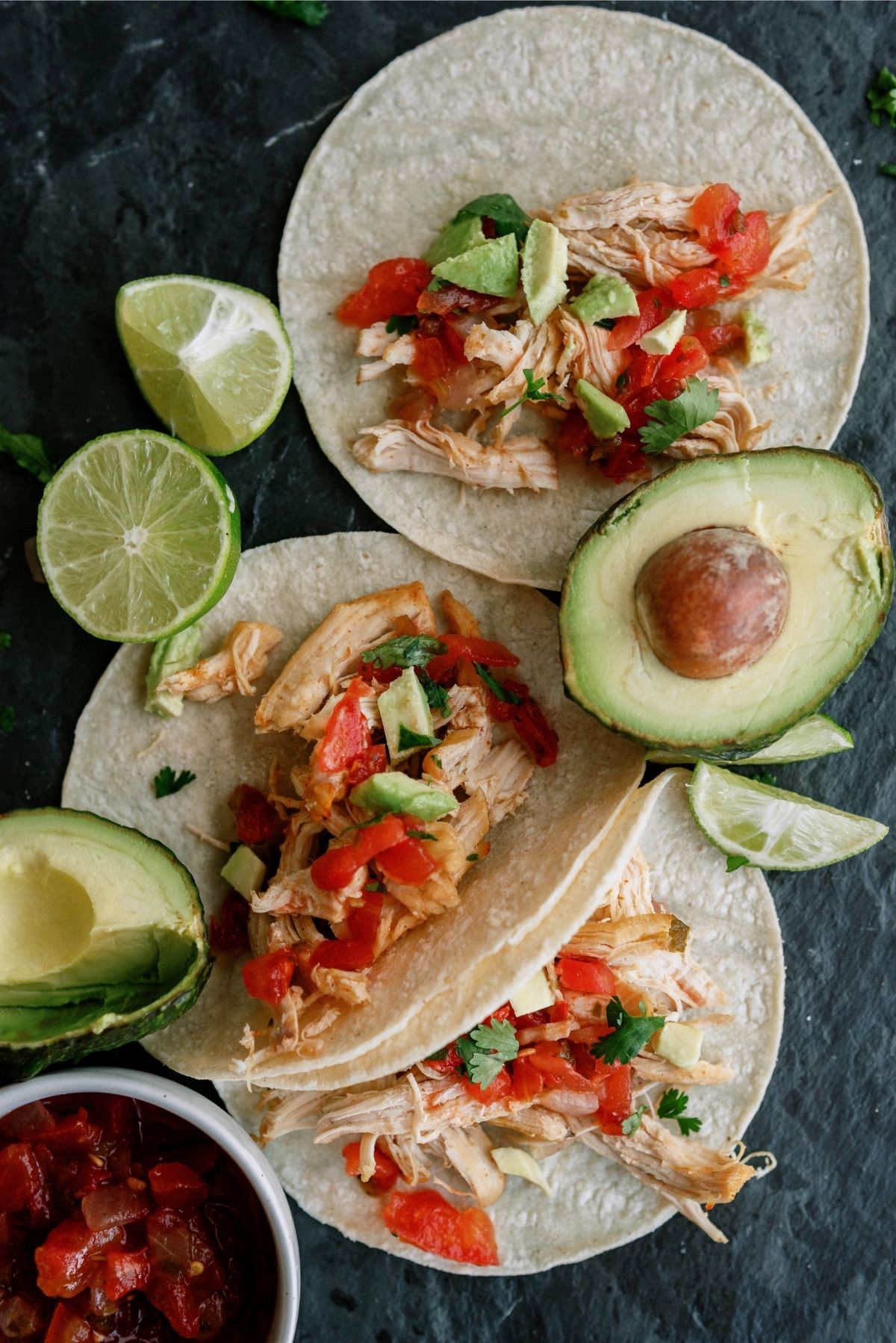 Instant Pot Chicken Carnitas on tortillas with toppings