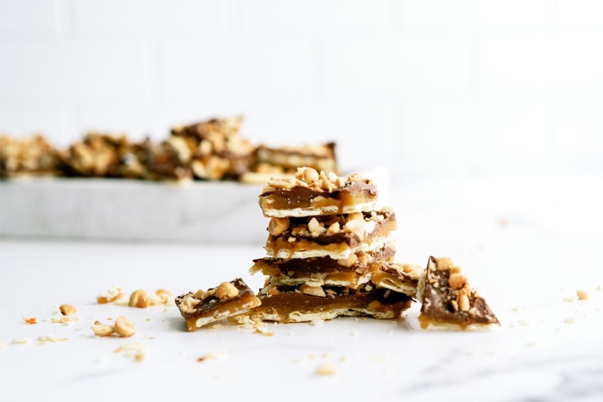 Saltine Cracker English Toffee in pieces stacked on a counter