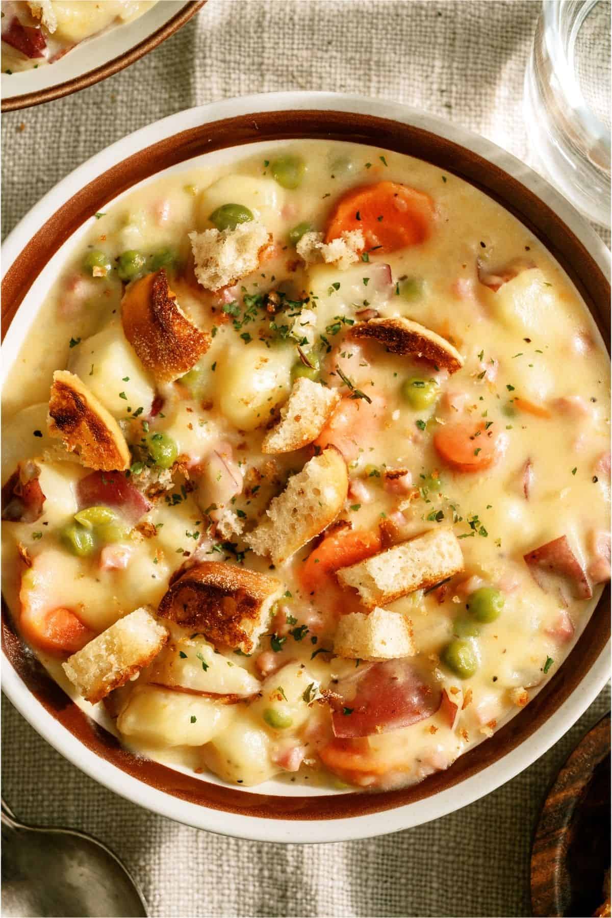 Close up of a bowl of Cheesy Ham and Potato Soup.