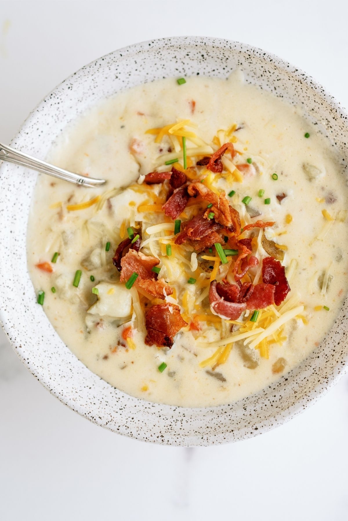 Disneyland’s Loaded Potato Soup in a bowl with toppings