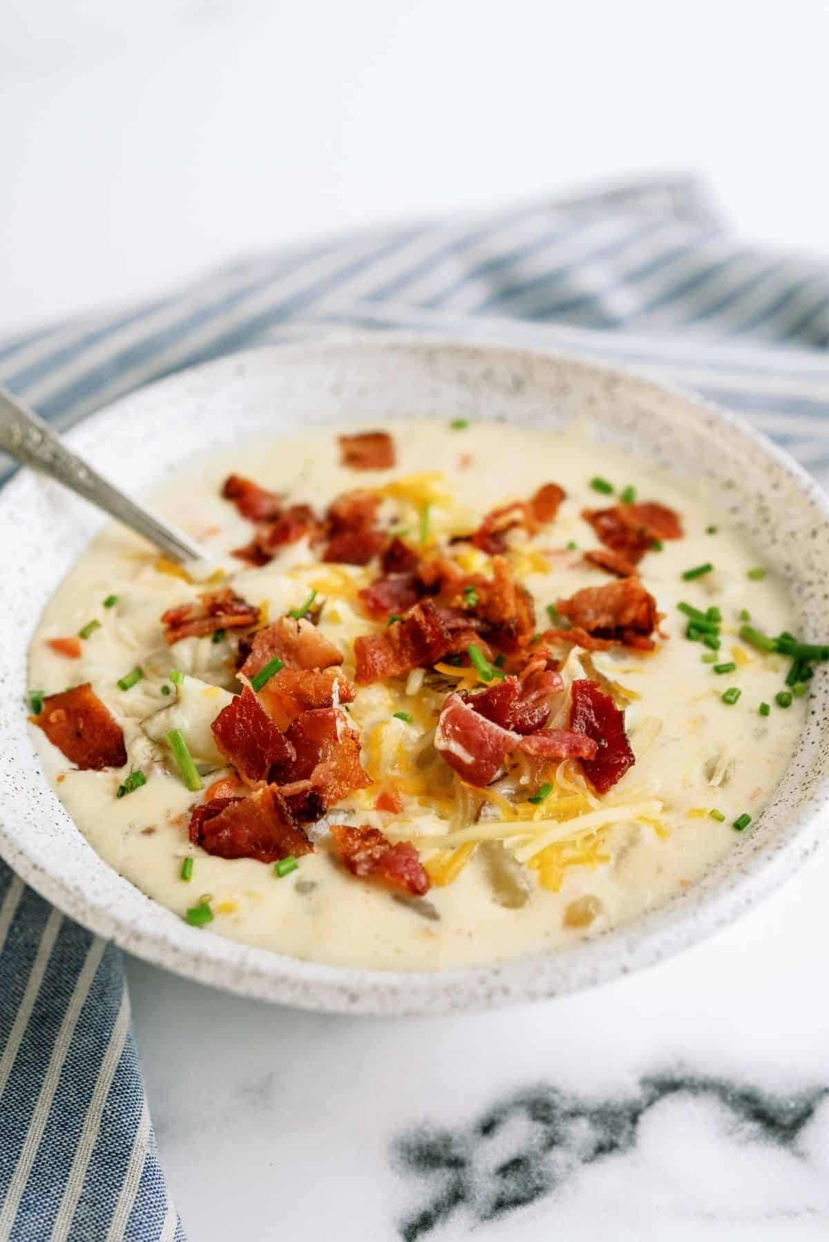 Disneyland’s Loaded Potato Soup in a bowl with toppings