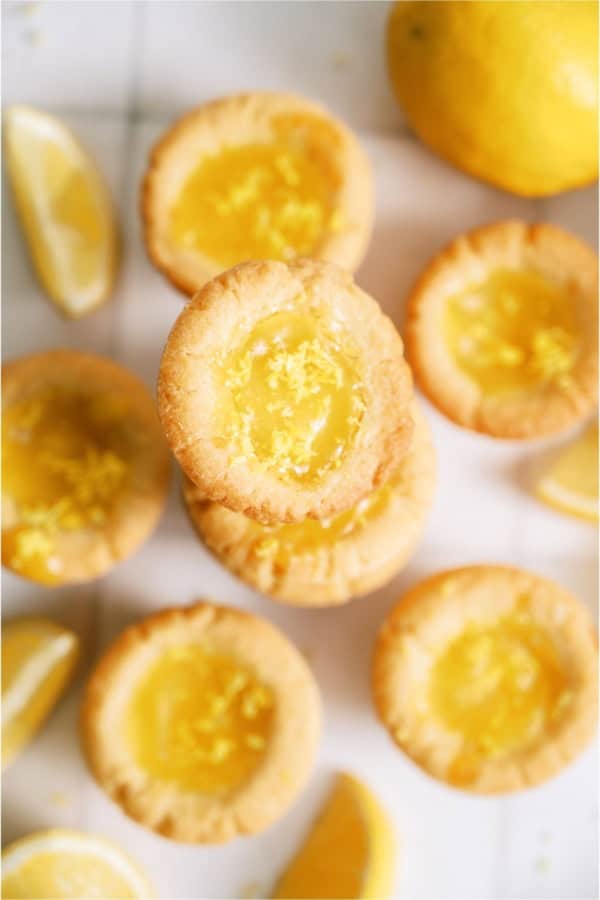 Lemon Bar Cookie Cups in a plie on a white background.