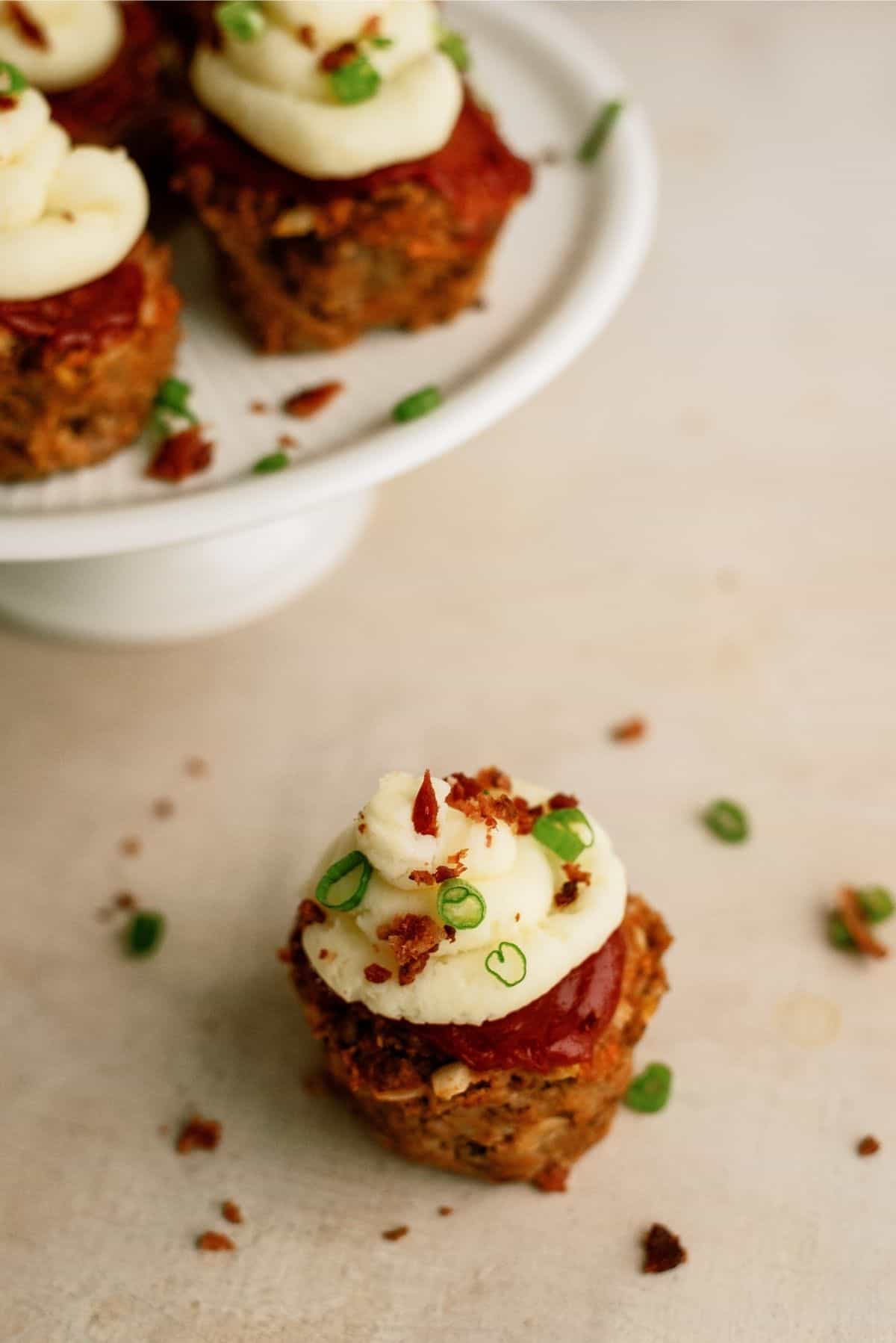 Close up of Meatloaf Cupcake with more in the background