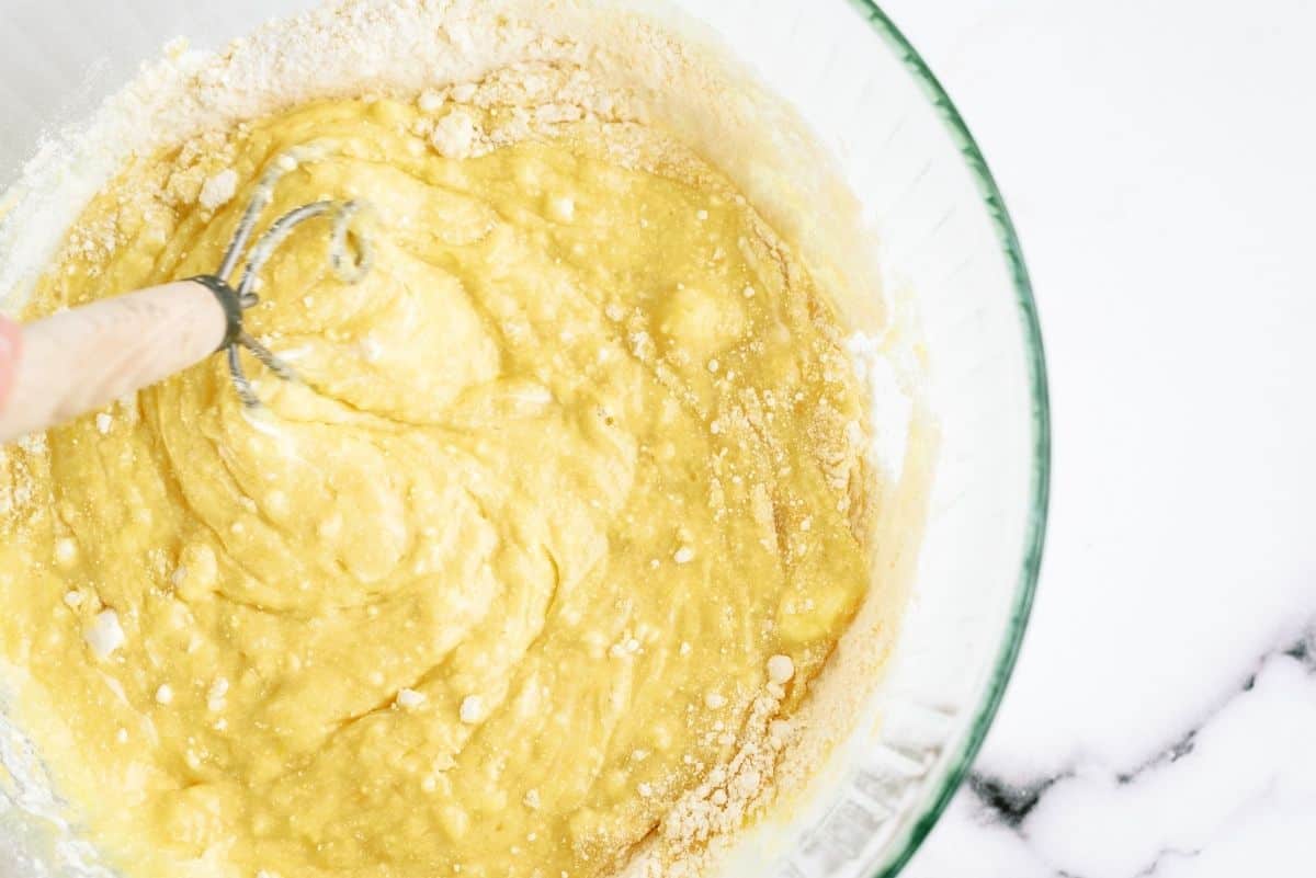 Mixing ingredients for the cake batter in a glass bowl