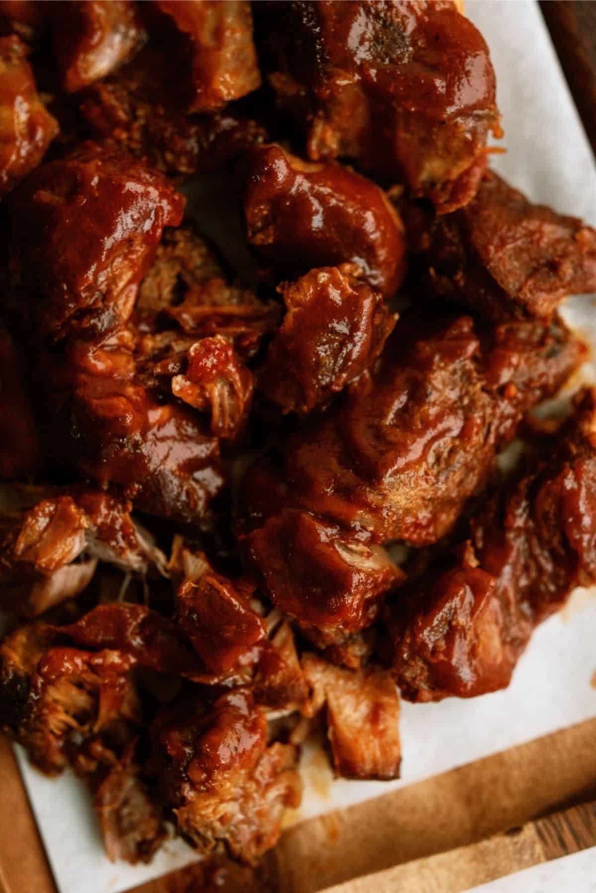 Close up of Slow Cooker BBQ Ranch Ribs on a cutting board