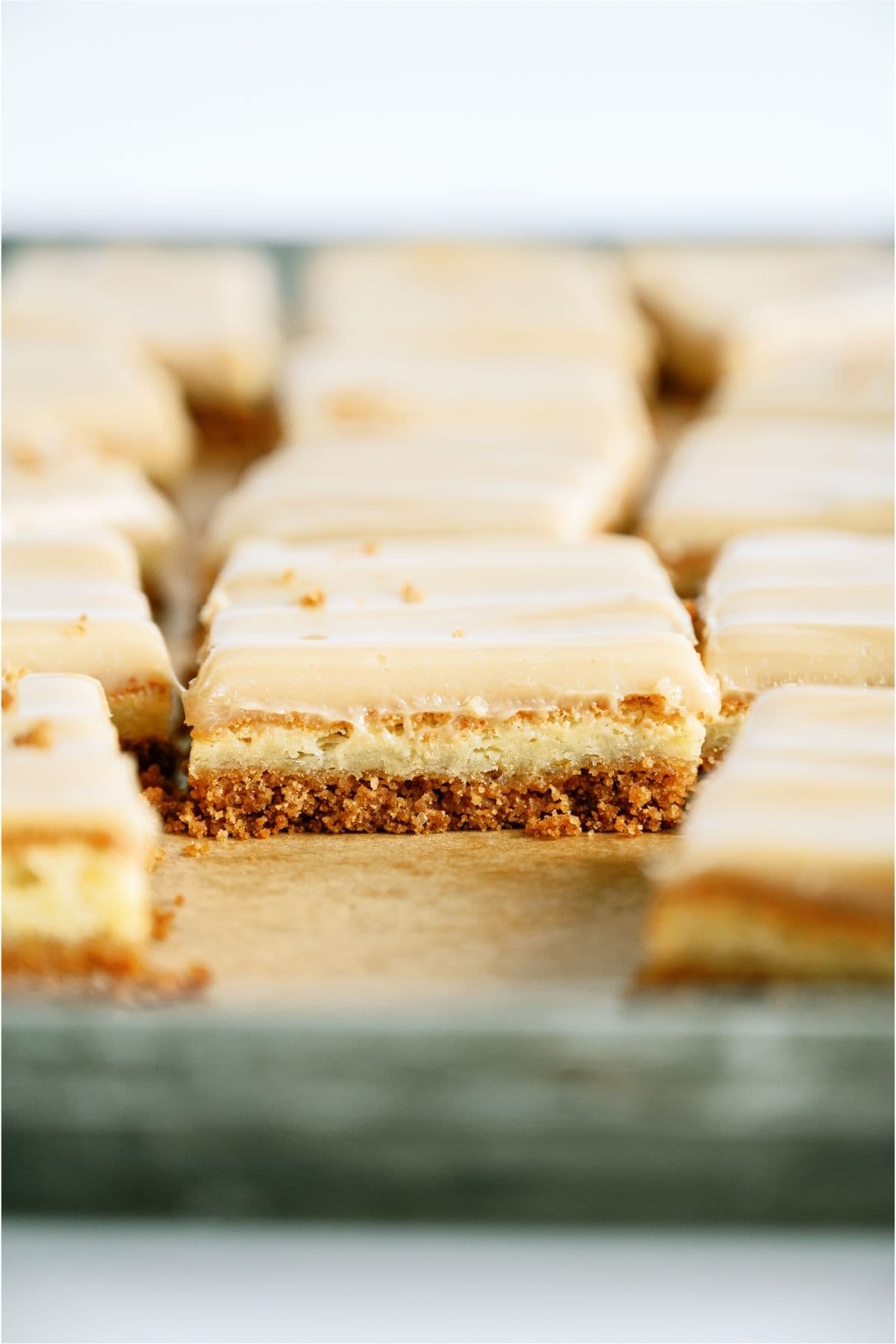 Side view of Caramel Cheesecake Bars to see the layers.